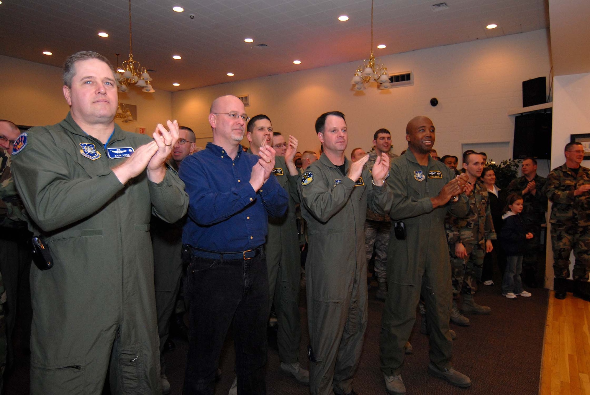 Members of the wing leadership cheer as the Guardian Challenge team members are introduced March 14 at the kick off event in the Grizzly Bend Club. The next big event is the fund-raising auction April 5, also at the Club, starting at 4 p.m. (U.S. Air Force photo/John Turner)