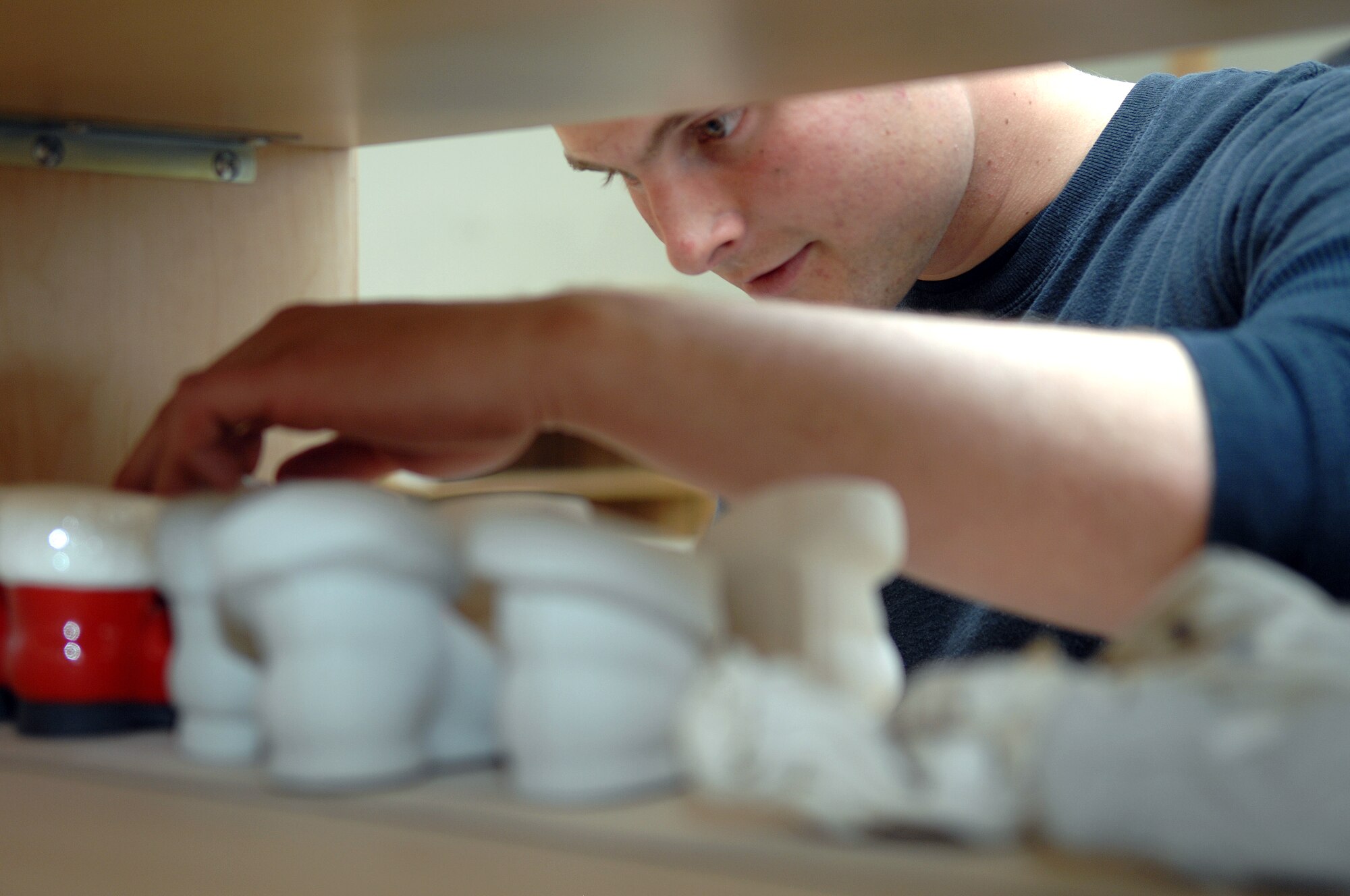 Airman 1st Class Don McGhee, 49th Security Forces Squadron, checks out molds at the Arts and Crafts Center on Holloman Air Force Base, N.M. The First Term Airmen Center program held a Service’s Day March 14 and the Arts and Crafts Center was one facility the new Airmen explored. (U.S. Air Force photo/Airman Sondra Wieseler)