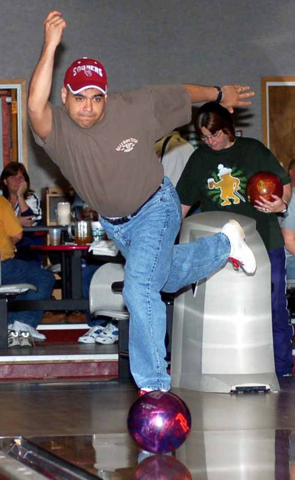 Hellifino bowler Christopher Ferrell throws a strike in game two of a match versus 4 the $$$ Again on March 12 at the Tinker Bowling Center. Hellifino won the match 3264-3250.  (Air Force photo by John E. Banks)
