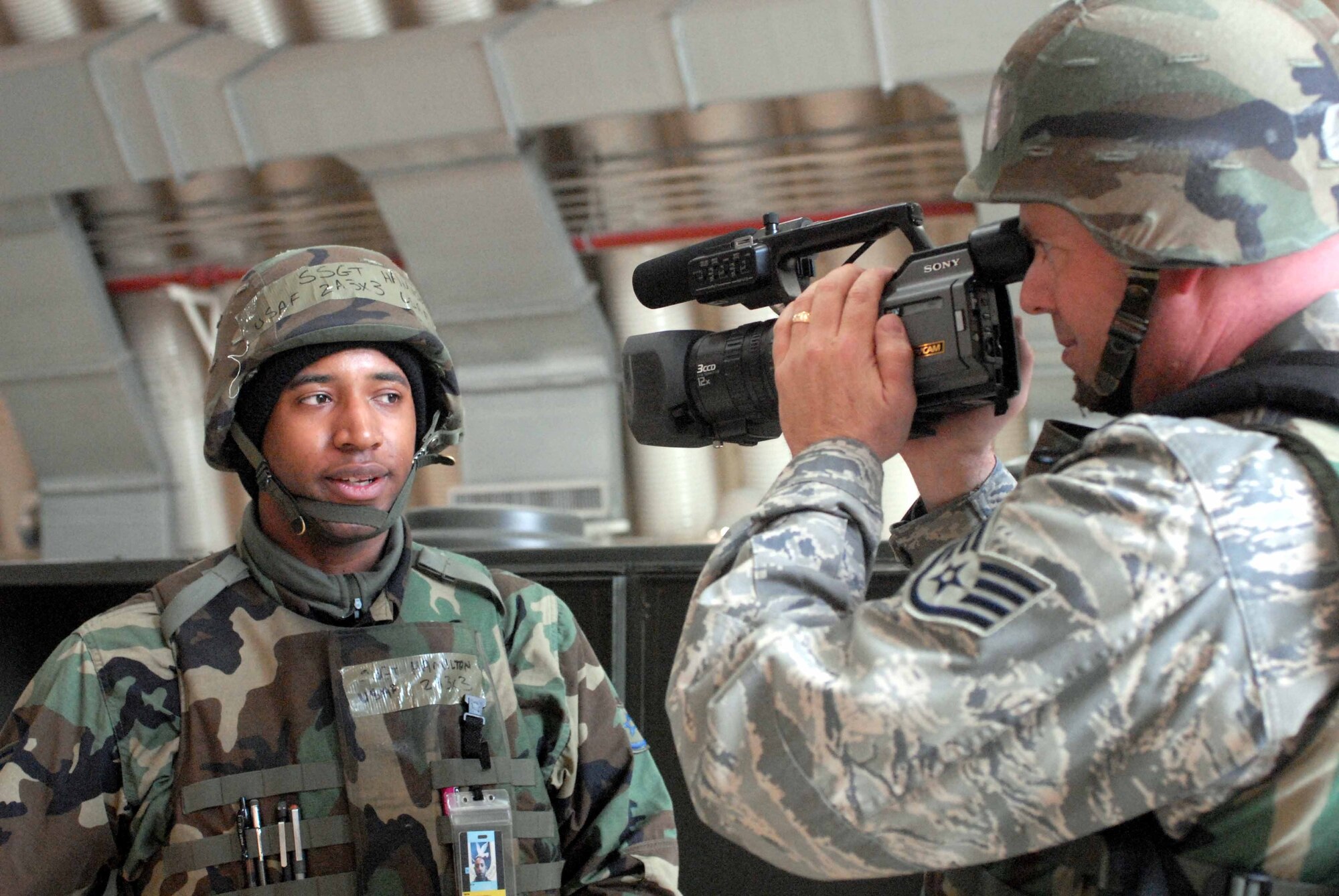 OSAN AIR BASE, Republic of Korea -- Staff Sgt. Vincent Hamilton, 25th Fighter Squadron crew chief, is interviewed by Staff Sgt. Ray Winstead, 51st Fighter Wing Public Affairs combat correspondent during Exercise Beverly Midnight March 18. (U.S. Air Force photo/Staff Sgt. Lakisha Croley)