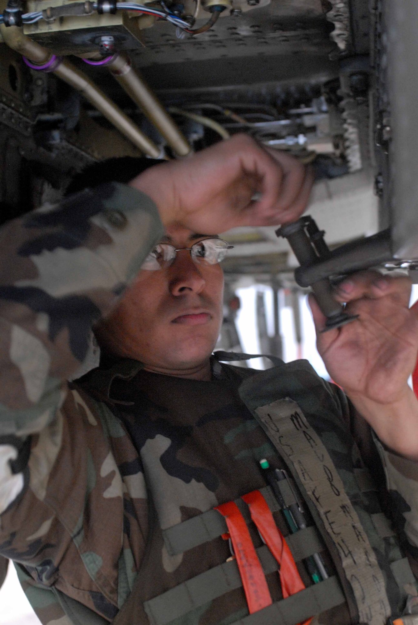 OSAN AIR BASE, Republic of Korea – Senior Airman Jacob Maldonado, 51st Aircraft Maintenance Squadron weapons aircraft team member, conducts daily maintenance on a triangular panel for a pylon on the A-10 Thunderbolt II aircraft during the Beverly-Midnight Exercise March 18. (U.S. Air Force photo/Staff Sgt. Lakisha Croley)