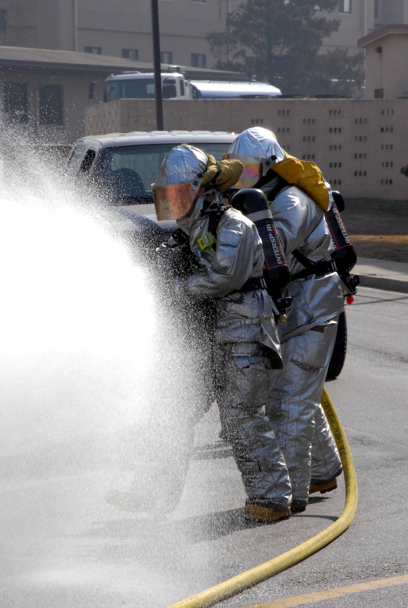 OSAN AIR BASE, Republic of Korea -- Members of Team Osan's Fire Department extinguish a fire during a simulated bus explosion March 17. The explosion was part of the Beverly-Midnight exercise. The purpose of this exercise is to test the base's readiness.  (U.S. Air Force photo/Staff Sgt. Lakisha Croley)