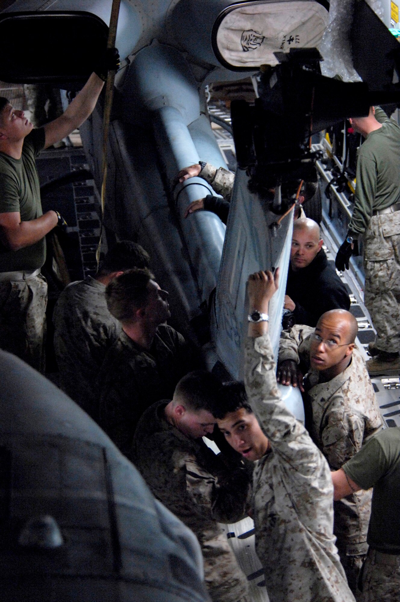 Marines with the 24th Marine Expeditionary Unit load three AH-1W Super Cobra helicopters onto an Air Force C-17 Globemaster III March 16 at Manas Air Base, Kyrgyzstan. The Marines are headed downrange to Afghanistan as part of the troop plus-up authorized by the president in January. The Marines will be a part of the NATO-International Security Assistance Force, conducting operations to extend the authority of the Government of the Islamic Republic of Afghanistan. (U.S. Air Force/Senior Airman Tabitha Kuykendall)