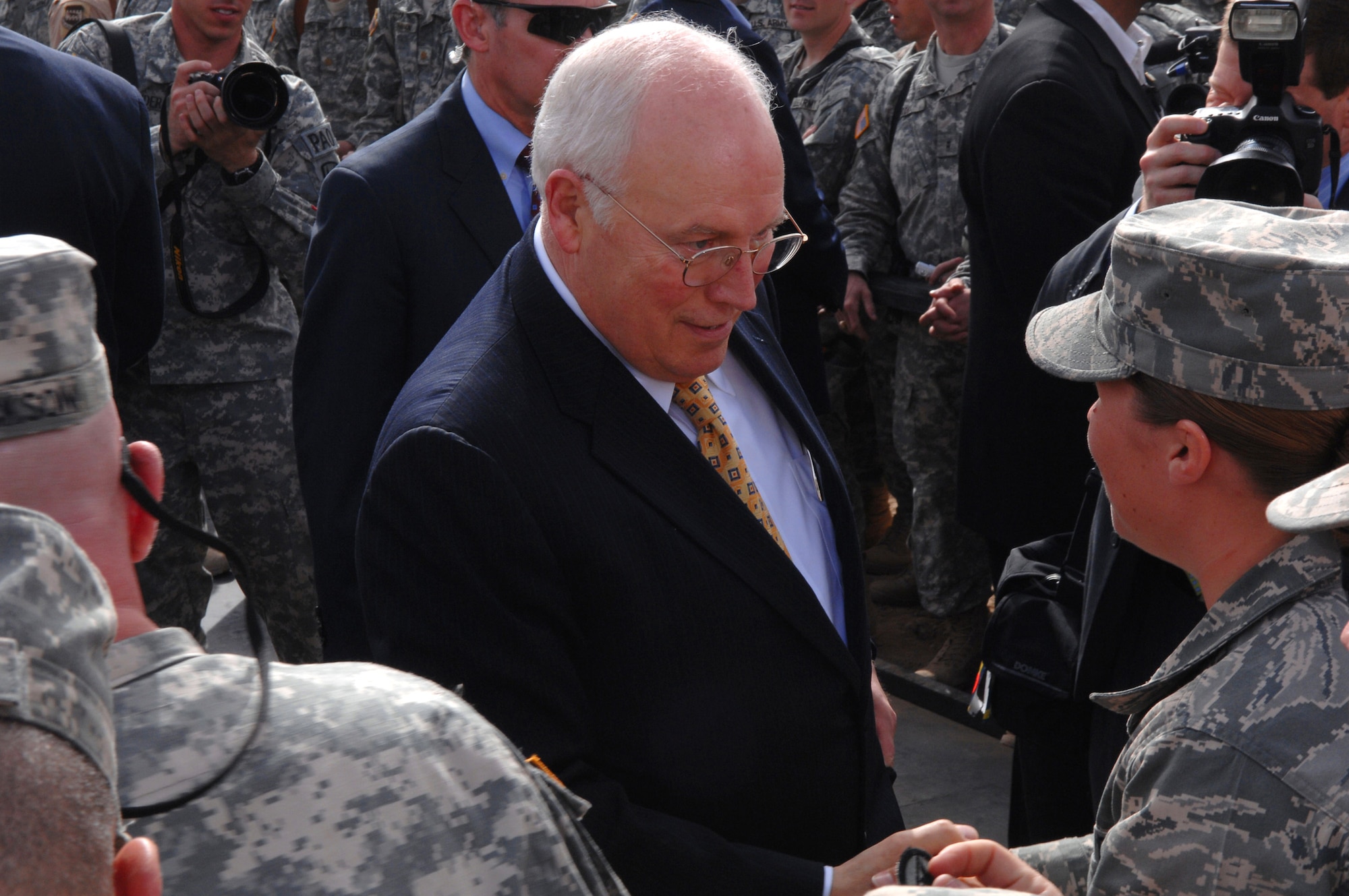 Vice President Dick Cheney shakes hands with servicemembers after a speech March 18 at Balad Air Base, Iraq. The vice president came to the base to visit deployed military men and women serving in support of Operation Iraqi Freedom. (U.S. Air Force photo/Senior Airman Julianne Showalter) 
