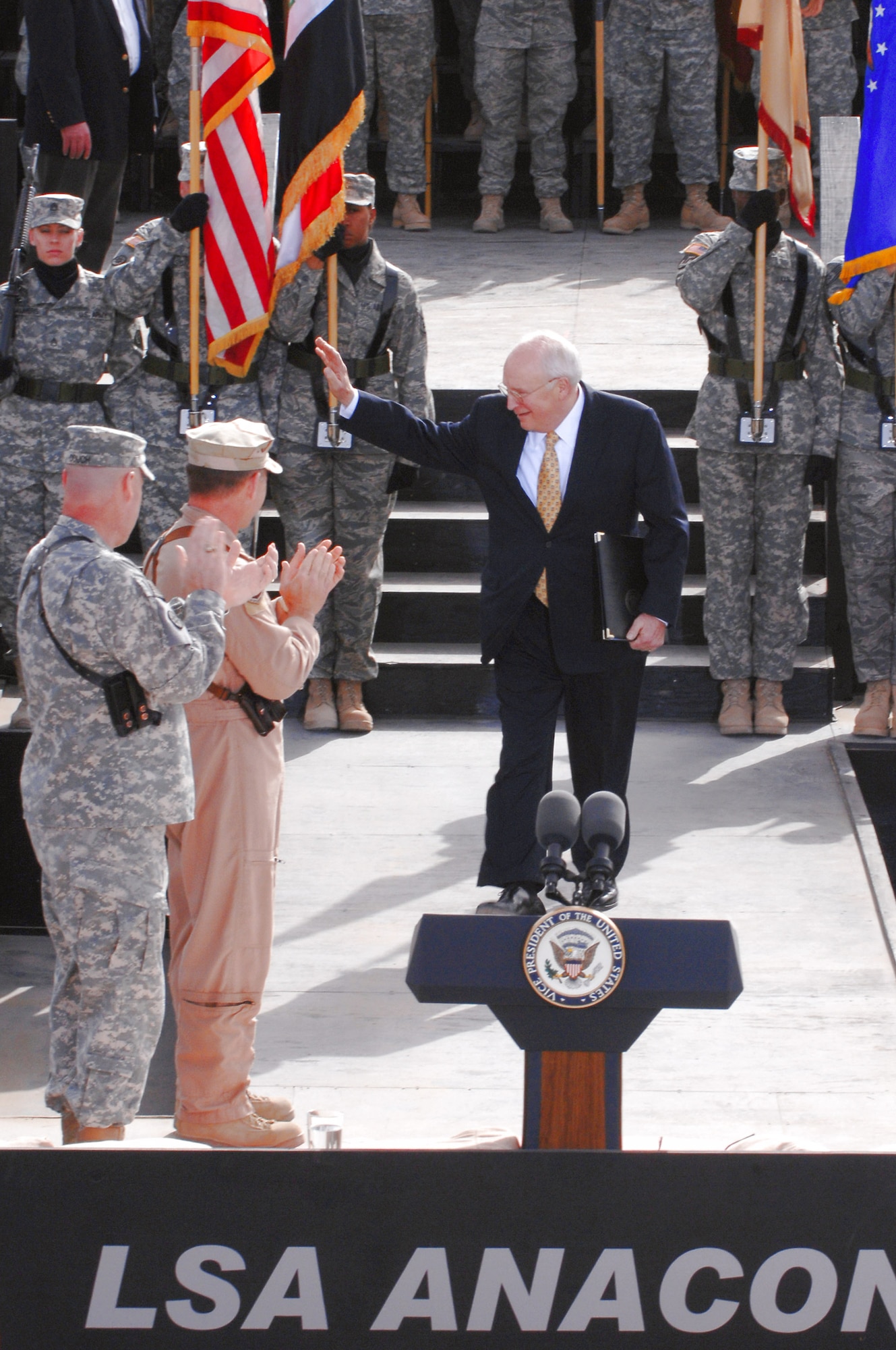 Vice President Dick Cheney waves to a crowd of uniformed servicemembers March 18 at Balad Air Base, Iraq. The vice president came to the base to visit deployed military men and women serving in support of Operation Iraqi Freedom. (U.S. Air Force photo/Senior Airman Julianne Showalter) 
