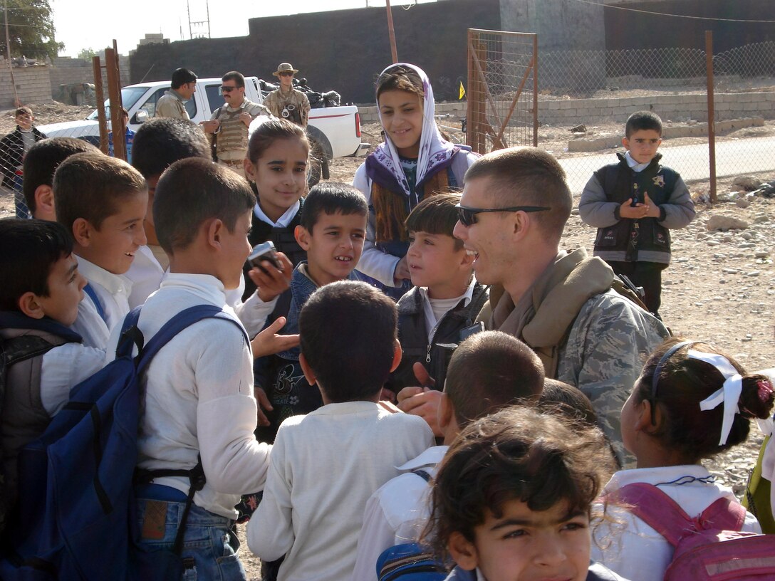 AFOSI agent with Iraqi children