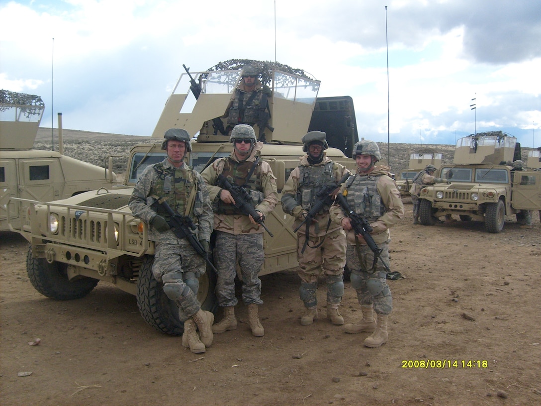 SEYMOUR JOHNSON AIR FORCE BASE, N.C. -- Master Sgt. Grady Raynor (far left) poses with his convoy crew during Combat Skills Training at Ft. Lewis, Wash. Sergeant Raynor is a heavy equipment operator with the 916th Civil Engineer Squadron here and is preparing for an upcoming deployment to Iraq.