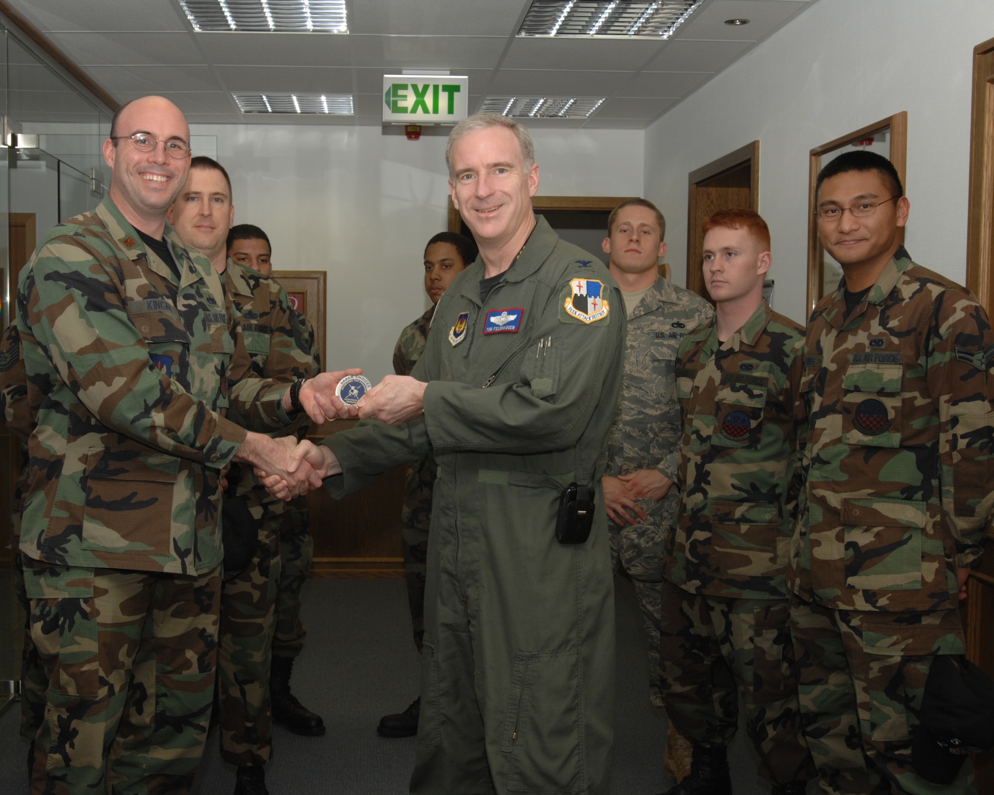SPANGDAHLEM AIR BASE, Germany – Col. Thomas Feldhausen, 52nd Fighter Wing commander, returns the 52nd Component Maintenance Squadron Saber Choices coin to 52nd CMS Airmen. The coin signifies that the unit has gone 52 days without any driving while under the influence or alcohol related incidents. (U.S. Air Force photo/Airman 1st Class Jenifer Calhoun)