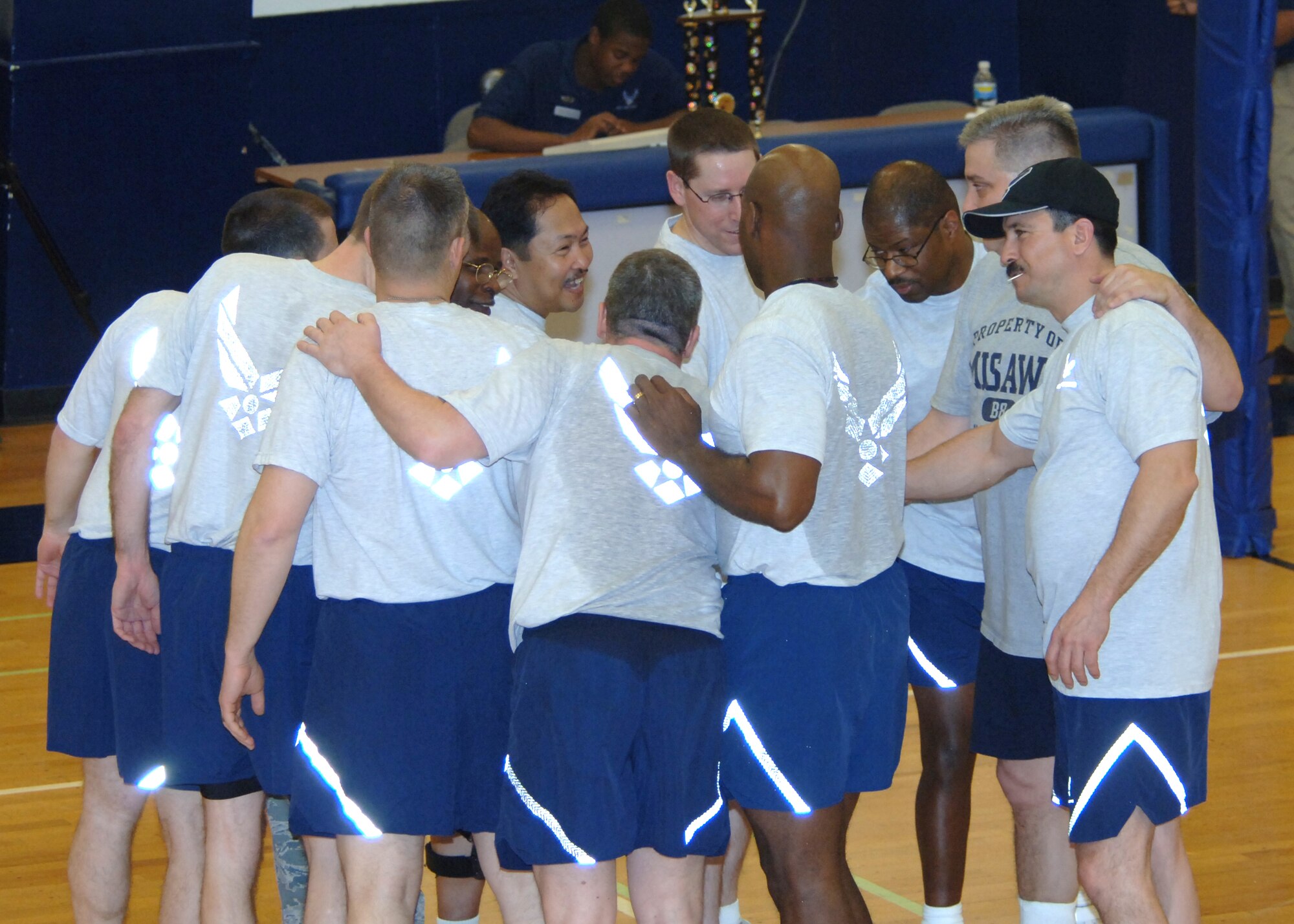 MISAWA AIR BASE, Japan -- The Chiefs celebrate at the end of the Eagles vs. Chiefs volleyball game at the Potter Fitness Center, March 14, 2008.  The Chiefs were awarded the trophy Friday after the best-out-of-five 25-point tournament.  (U.S. Air Force photo by Senior Airman Robert Barnett)