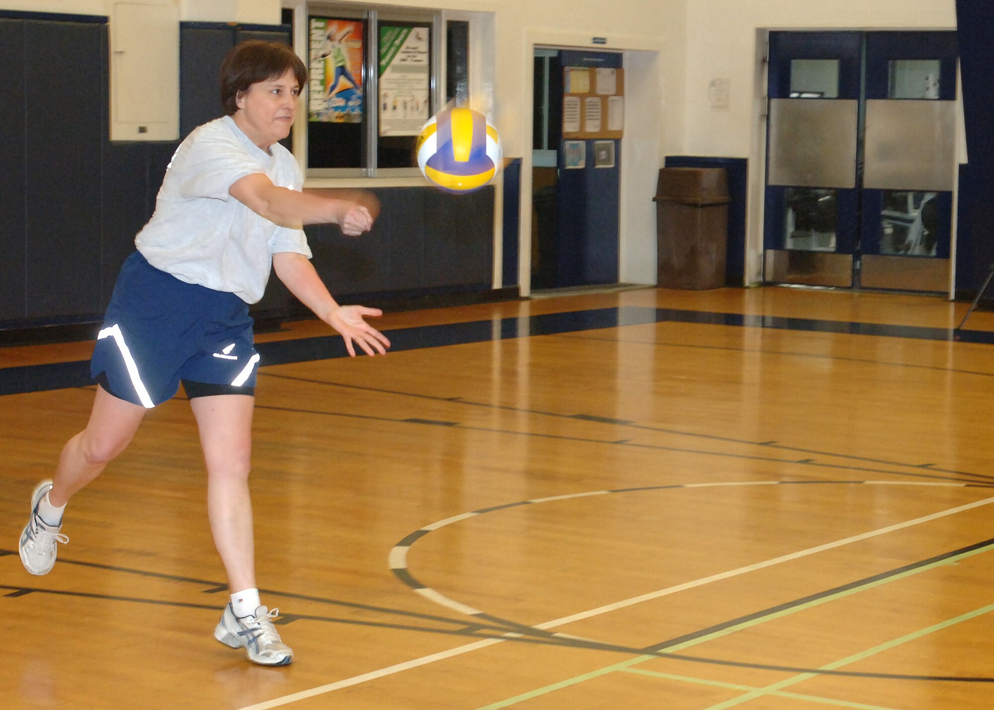 MISAWA AIR BASE, Japan -- Col. Mary Armour, 35th Medical Group commander, serves the ball during the Eagles vs. Chiefs volleyball game at the Potter Fitness Center, March 14, 2008.  The best-out-of-five series of games was tied until the end when the Chiefs earned their victory.  (U.S. Air Force photo by Senior Airman Robert Barnett)