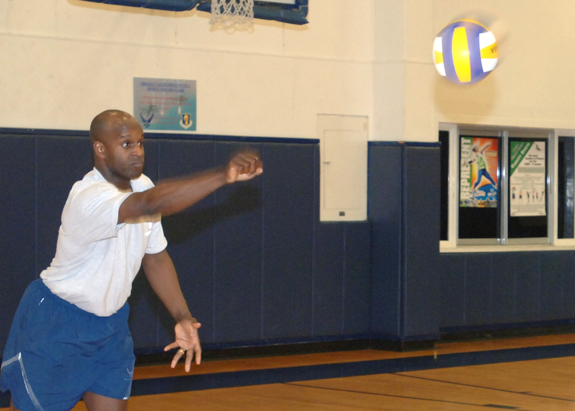 MISAWA AIR BASE, Japan -- Col. Cedric George, 35th Maintenance Group commander, serves the ball during the Eagles vs. Chiefs volleyball game at the Potter Fitness Center, March 14, 2008.  The hard-fought series of games left the Chiefs with a well-earned victory.  (U.S. Air Force photo by Senior Airman Robert Barnett)