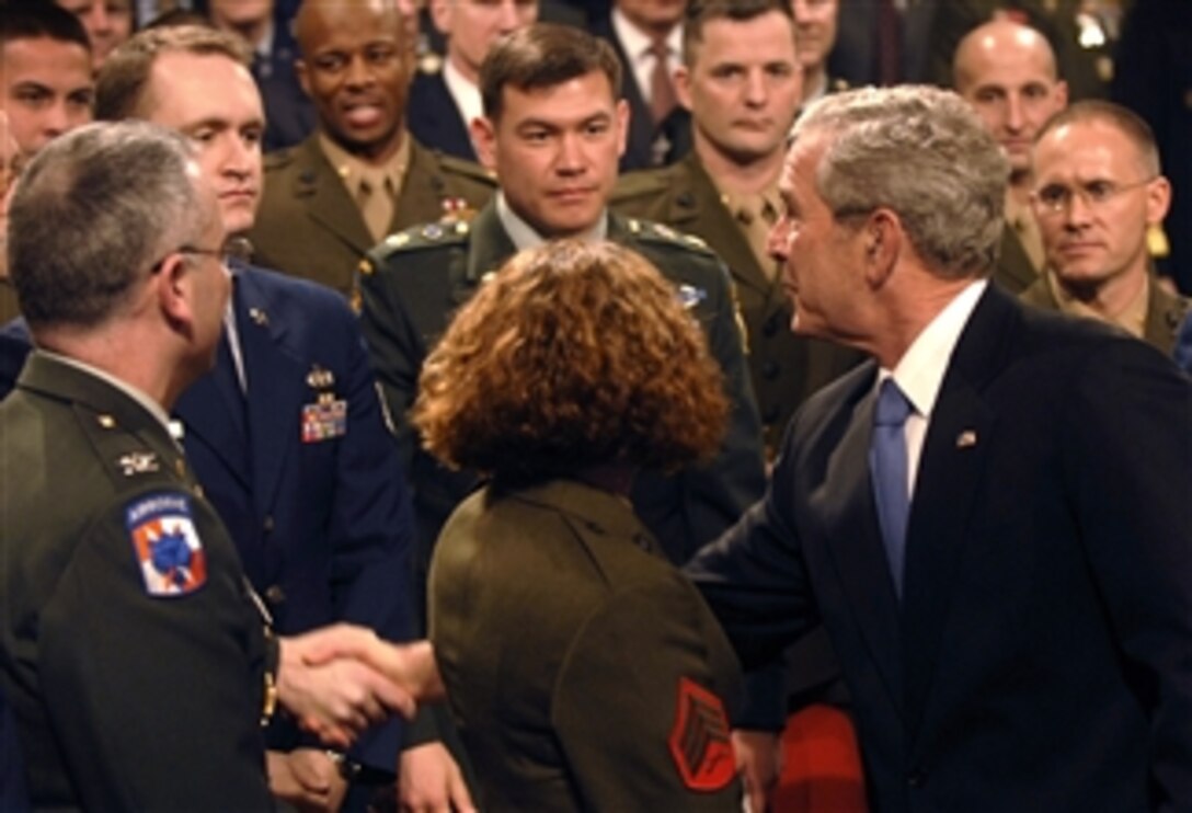 President George W. Bush shakes hands with servicemembers after a delivering a speech March 19, 2008, at the Pentagon on the progress of the global war on terrorism on the fifth anniversary of the start of coalition operations in Iraq.