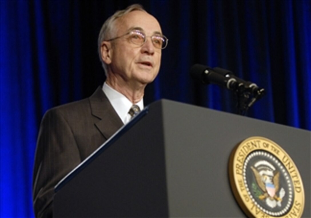 Deputy Secretary of Defense Gordon England introduces President George W. Bush to the audience in the Pentagon auditorium on March 19, 2008.  Bush addressed members of the Armed Forces, Department of Defense and Department of State employees about the progress made in Iraq and the Global War on Terror.  