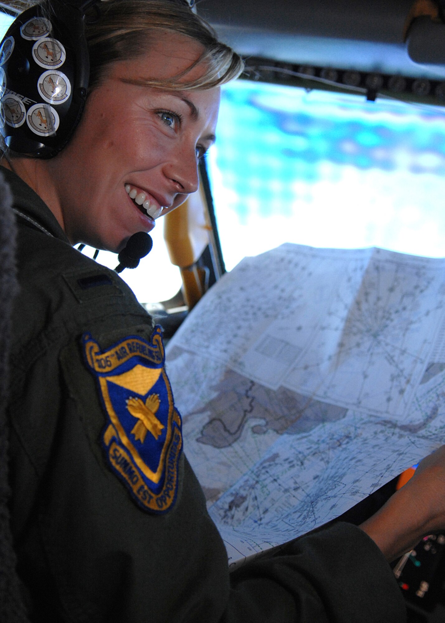 Andersen AFB, Guam -- 1st Lt. Lauren Diskell reads an aerial map while flying her KC-135 Stratotanker during a practice aerial refueling mission near the Mariana Islands. The KC-135 Stratotankers refuel the B-52 Stratofortressess that support the U.S. continuous bomber presence in the Pacific region. Lt. Diskell is deployed from the 106th Air Refueling Squadron, Alabama Air National Guard.
(U.S. Air Force Photo By Staff Sgt. Vanessa Valentine)