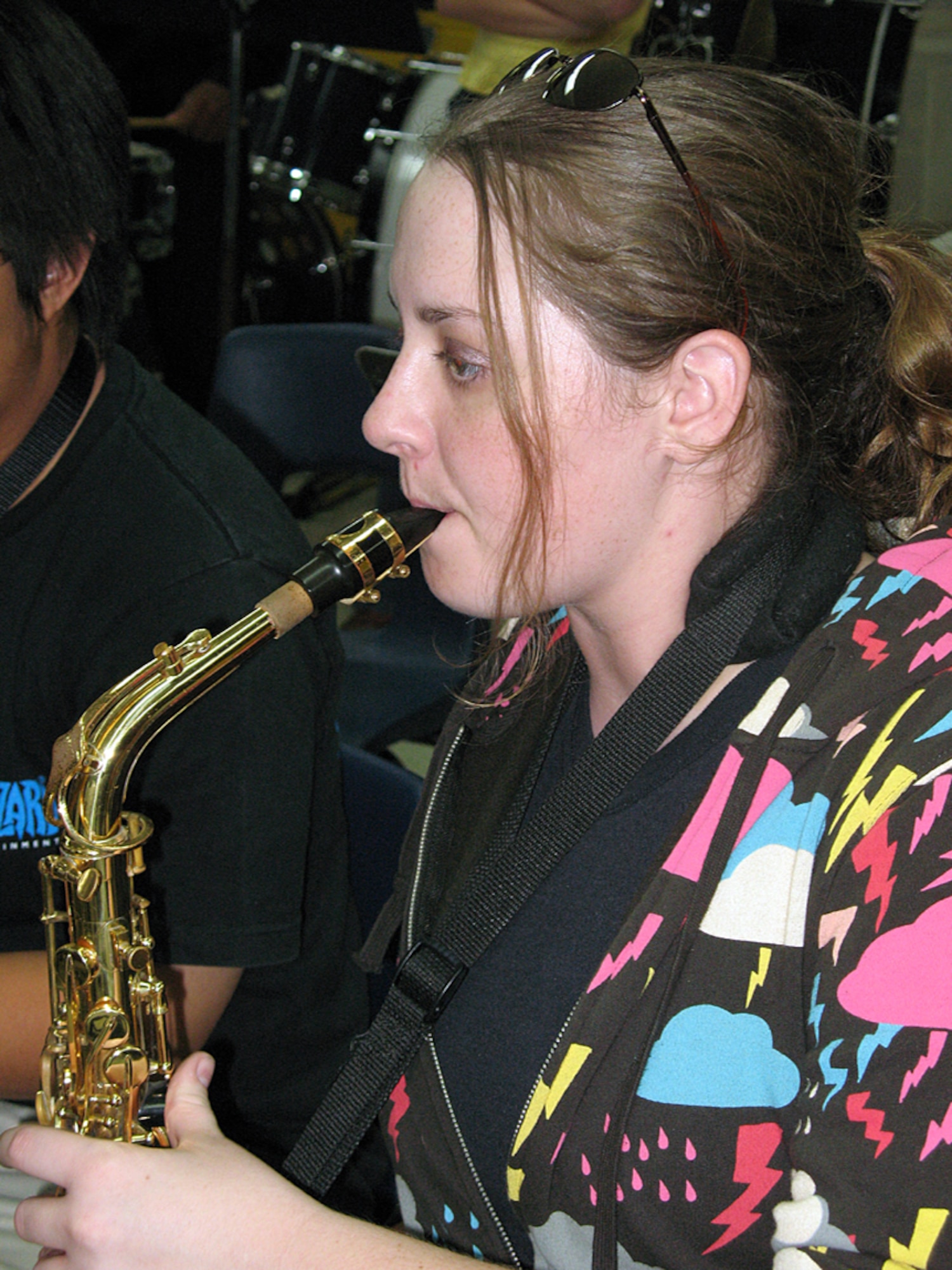 Senior Airman Rebecca Cook, a boundary protection specialist with the 36th Comunications Squadron plays the 1st Alto Saxophone with the Guam Territorial Band Mar. 20 during a scheduled practice session. SrA Cook has been playing the 1st Alto Saxophone since the age of eight.  (U.S. Air Force photo by Airman 1st Class Carissa Wolff)