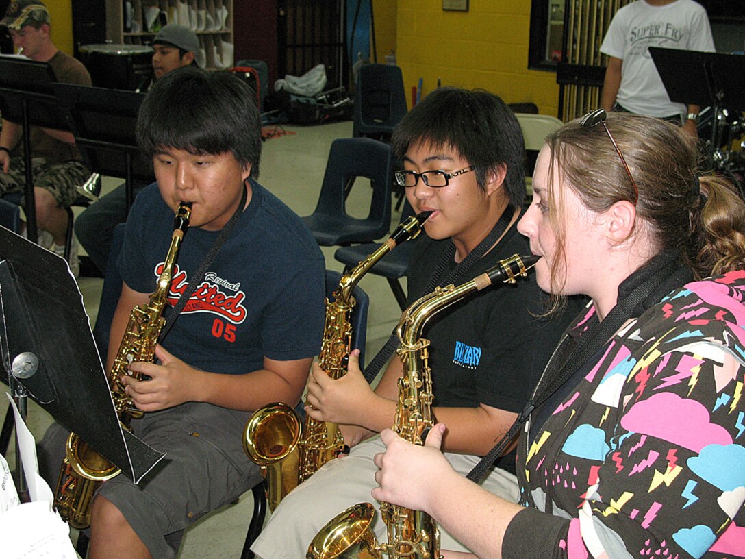 Senior Airman Rebecca Cook, a boundary protection specialist with the 36th Comunications Squadron played with the Saxophone section of the Guam Territorial Band Mar. 20 during a scheduled practice session.  (U.S. Air Force photo by Airman 1st Class Carissa Wolff)
