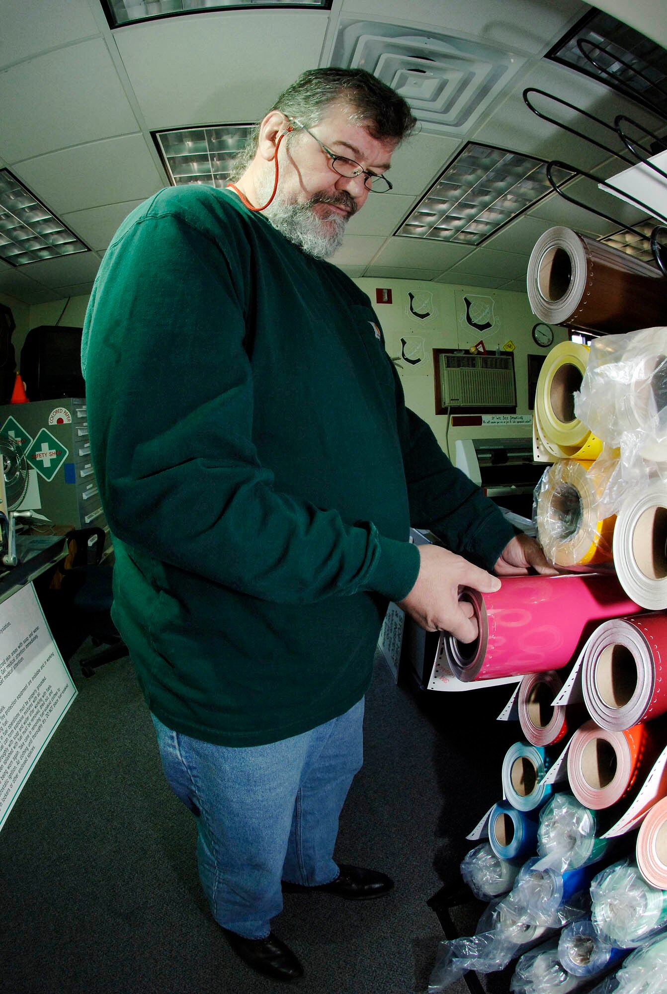 FAIRCHILD AIR FORCE BASE, Wash. – Dave Franklin, 92nd Civil Engineer Squadron sign painter, selects the proper color scheme for a sign March 18. Once the vinyl is chosen, it’s cut and placed into a plotter for print. (U.S. Air Force photo/Staff Sgt. JT May III)