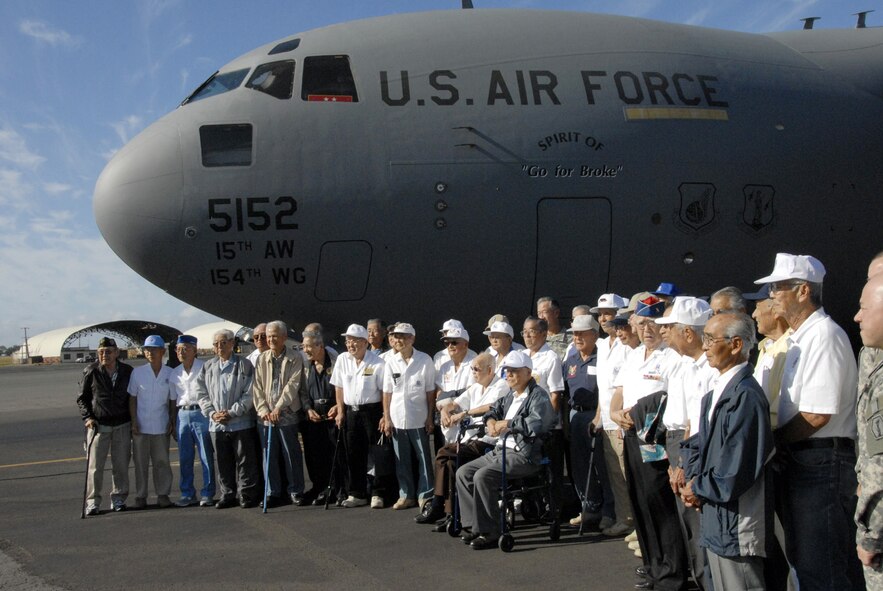 HICKAM AIR FORCE BASE, Hawaii -- Surviving members of the famed 442nd Regimental Combat Team and the 100th Infantry Battalion pose in front of one Hickam’s C-17 aircraft the "Spirit of Go For Broke" which was named after the motto of the historic World War II Army units that consisted of Japanese Americans mostly from Hawaii. The “Go For Broke” unit was one of the most highly decorated units during WWII. (U.S. Air Force photo/Tech. Sgt. Tom Czerwinski)