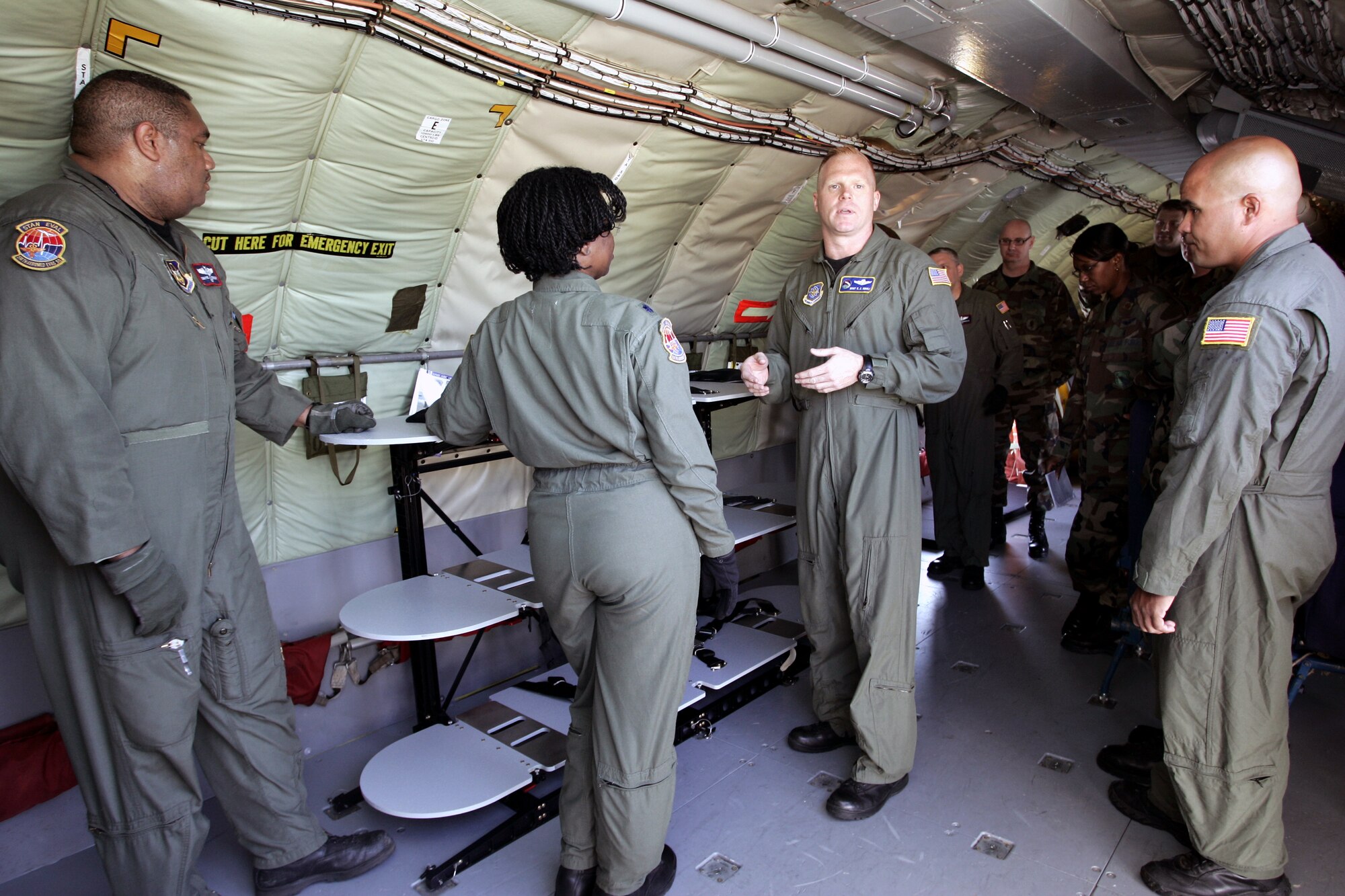 Master Sgt. Chris Sidoli (center), Air Mobility Battlelab, works with KC-135 Stratotanker aircrew members from the 108th Air Refueling Wing, McGuire Air Force Base, N.J., during a demonstration for the stacking litter system initiative June 22, 2007, on McGuire.  Air Mobility Command's Surgeon General Readiness Division has said the versatile and portable system will contribute to a "more robust and flexible aeromedical evacuation system."  The Air Mobility Battlelab is located in the U.S. Air Force Expeditionary Center on Fort Dix, N.J.  (U.S. Air Force Photo/Master Sgt. Bob Lorusso) 