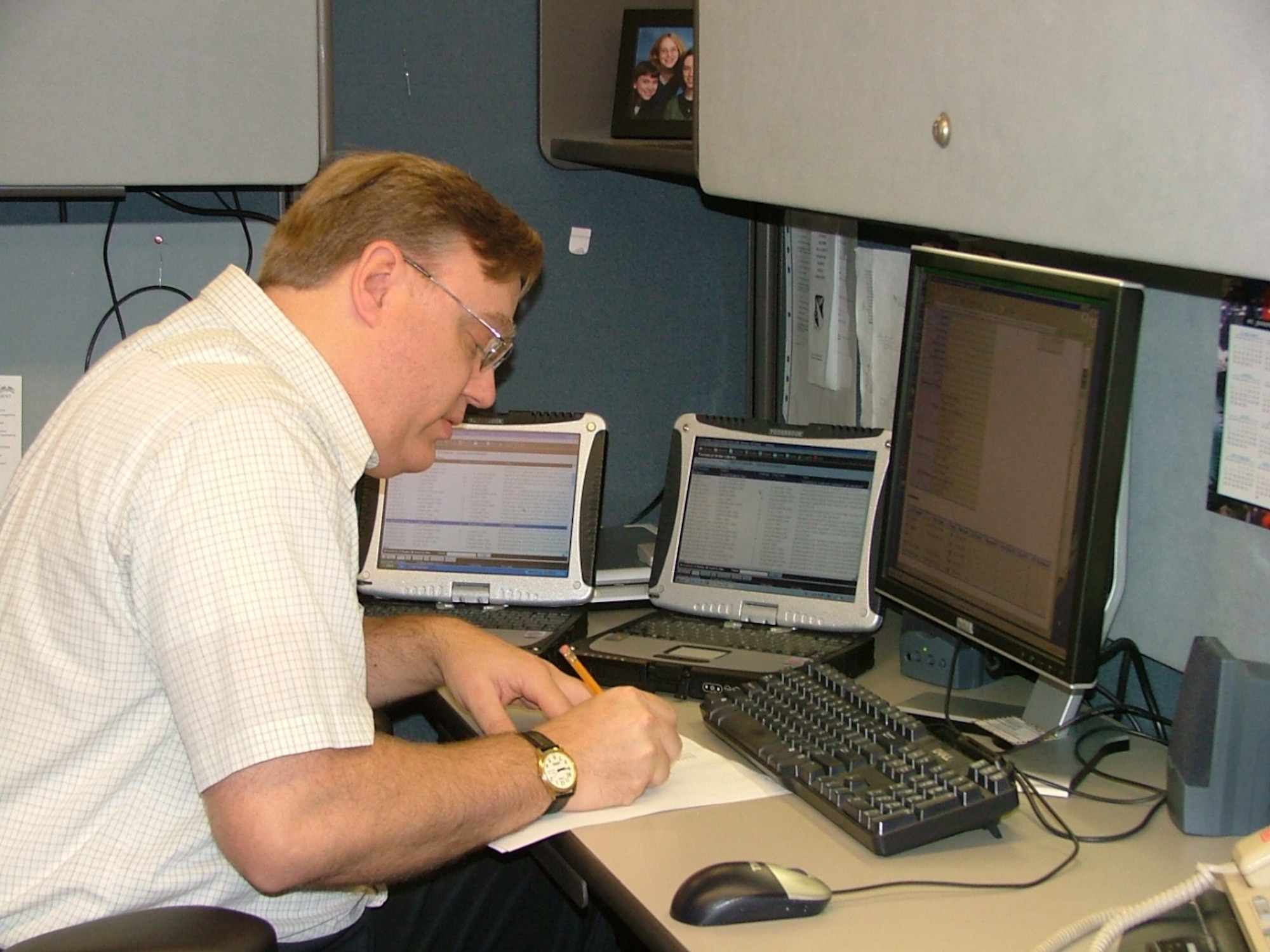 Mr. Jerry Kosey, lead engineer for the ETIMS eTO Viewer, assesses the process of loading eTOs into ETIMS.  Once validated by the Tech Order Managers, these TOs will be electronically available to authorized users throughout the Air Force.  (Air Force photo by Dick Smith)