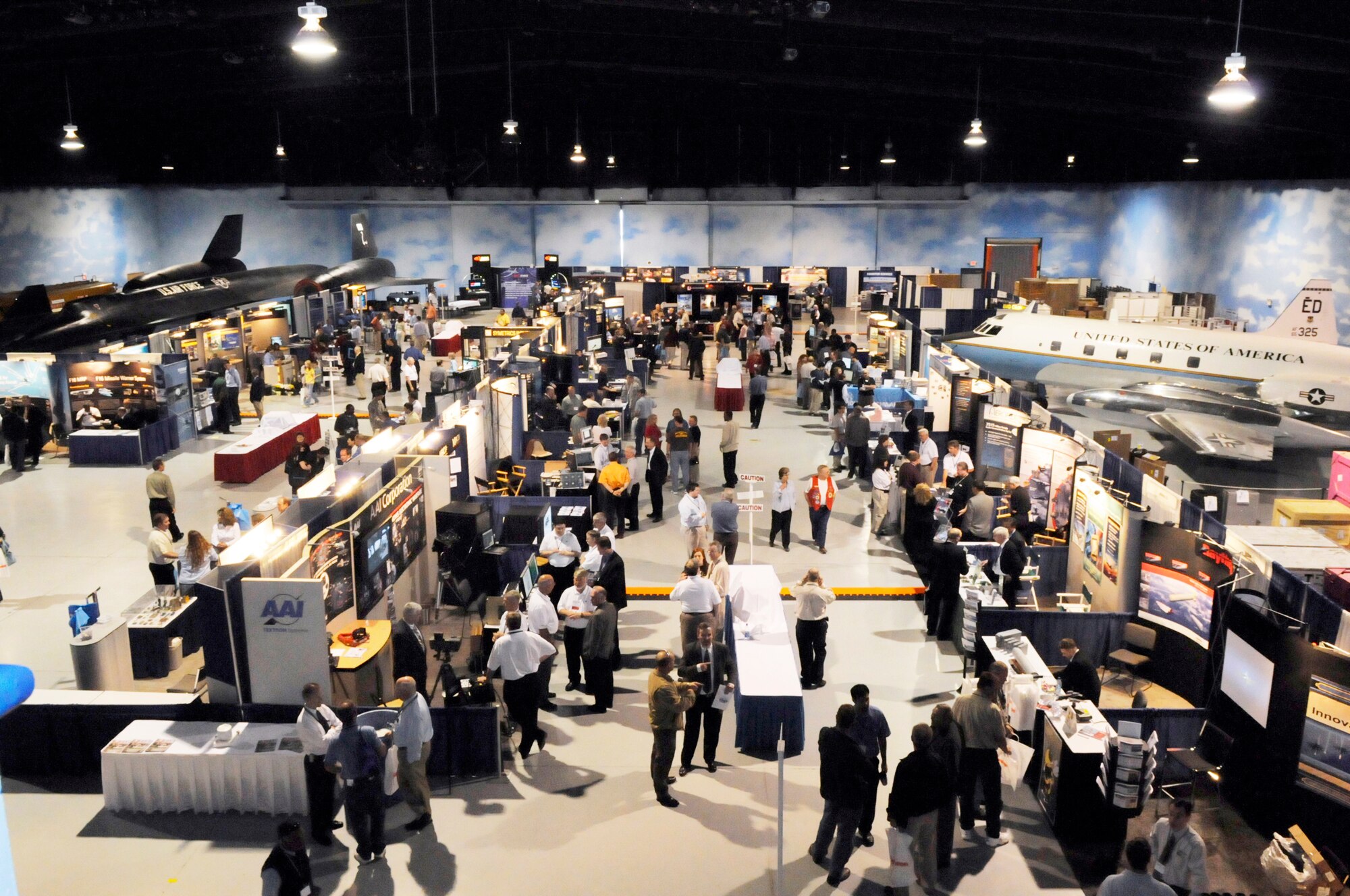 The floor of the Century of Flight hanger was filled with vendors' displays at the 33rd Annual 542nd Combat Sustainment Group and Dixie Crows Electronic Warfare Symposium this week. U. S. Air Force photo by Sue Sapp