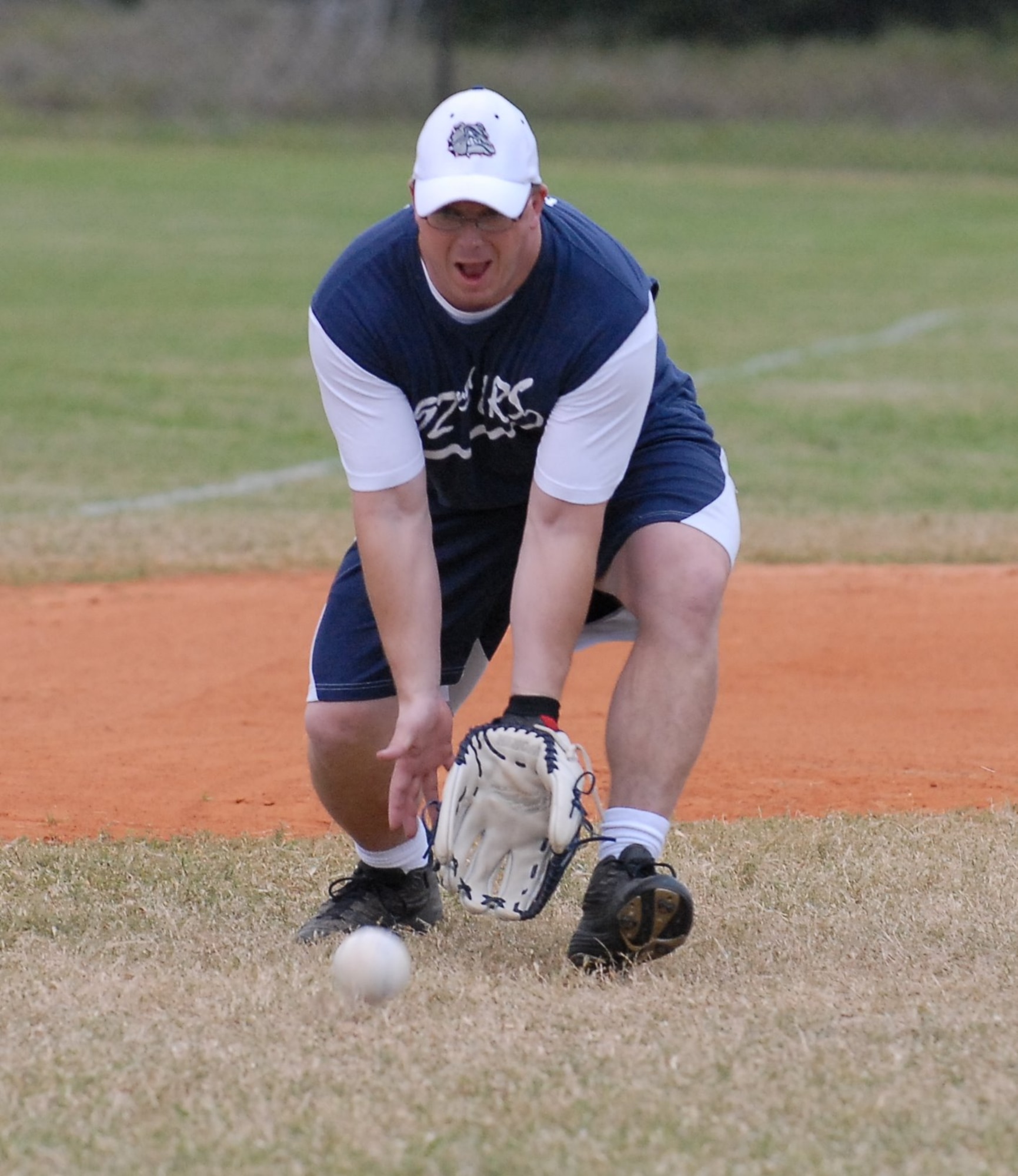 Staff Sgt. Kevin Kerker, third baseman for the 45th Medical Group, goes for a ground ball during Game 5 of the 2008 Intramural Softball Championship game March 14. AFTAC bested the 45th Medical Group 17-5 to win the Championship.