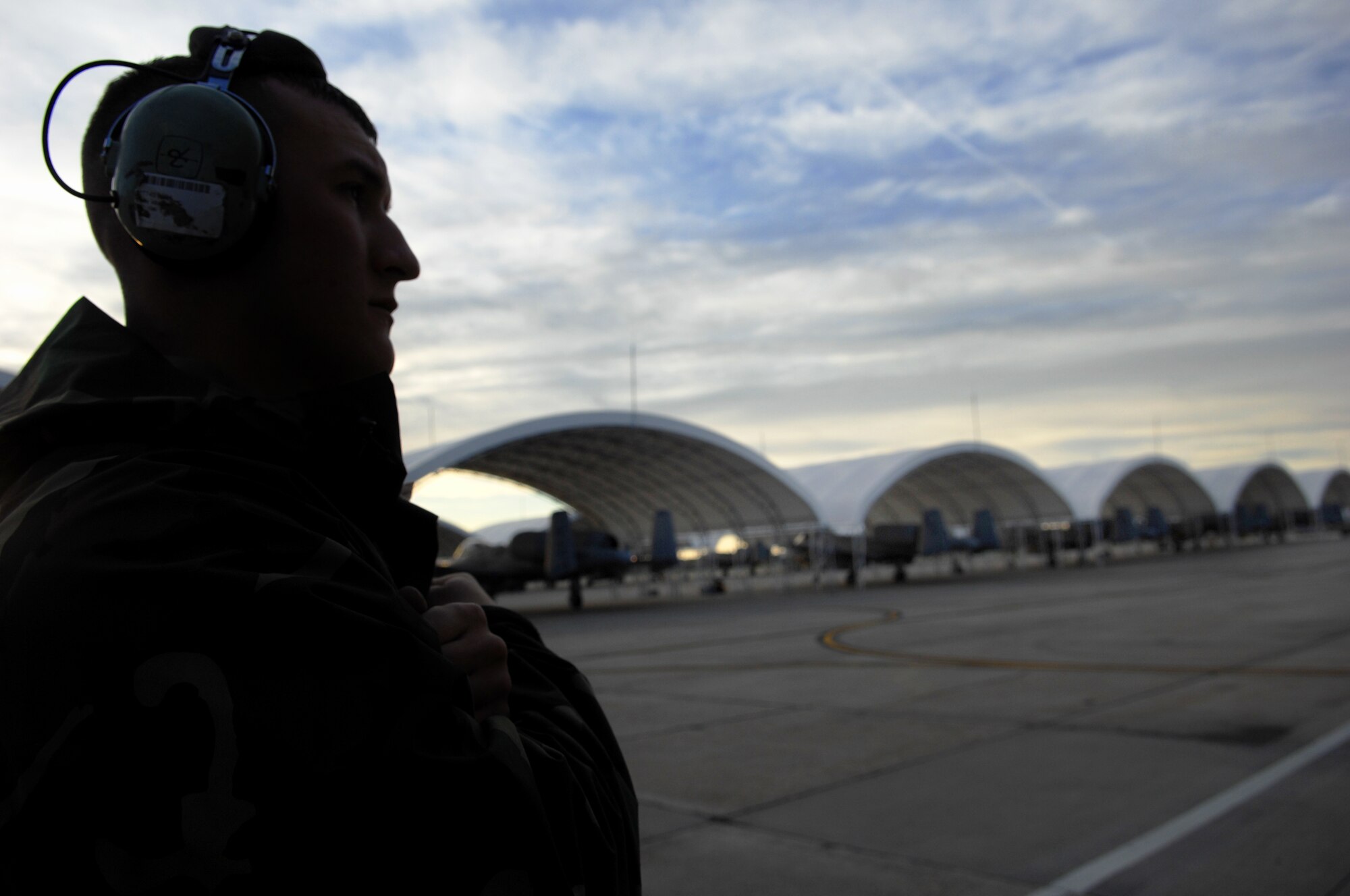 MOODY AIR FORCE BASE, Ga. – Airman 1st Class Kenny Marthey, 74th Fighter Squadron A-10C Thunderbolt II crew chief, waits patiently to give the hand signals to the pilot to depart here March 20.  More than 15 A-10s left Moody enroute to Nellis Air Force Base, Nev. to participate in the exercise Green Flag. (U.S. Air Force photo by Senior Airman Angelita Lawrence)