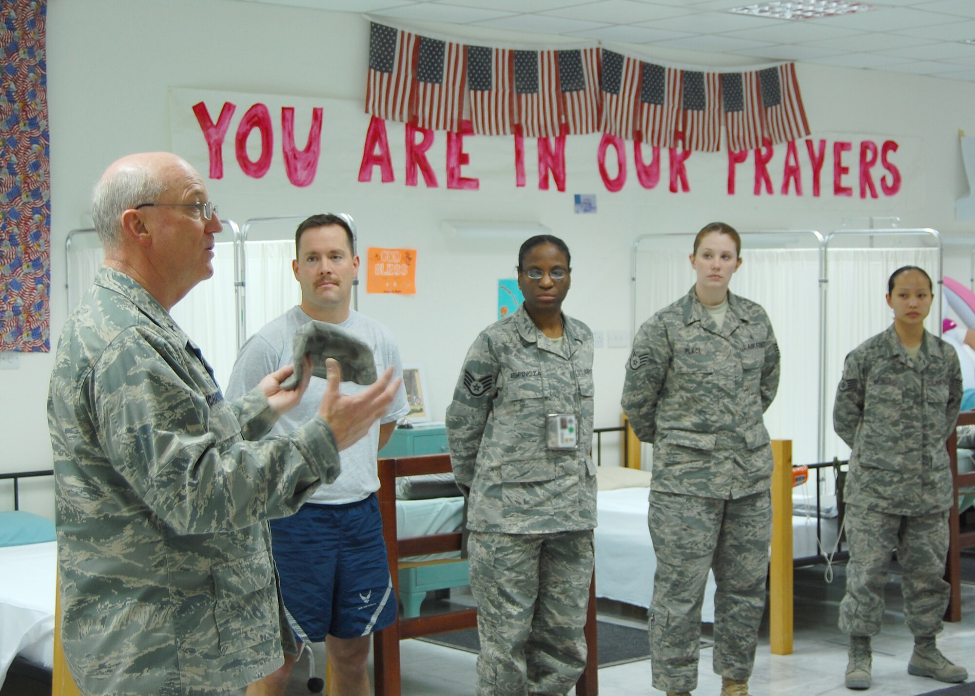 Chaplain (Brig. Gen.) Cecil Richardson, Air Force Deputy Chief of Chaplains, speaks to Airmen deployed to the 386th Medical Group's Contingency Aero-Medical Staging Facility during his visit to the 386th Air Expeditionary Wing, at an air base in the Persian Gulf Region. The general traveled to the wing to visit deployed Airmen and participate as the guest speaker at the wing's National Prayer Breakfast. The CASF is a staging facility with personnel and equipment ready for aeromedical evacuation of ill or wounded U.S. military servicemembers, coalition forces and civilian contract personnel en-route from forward operating locations to medical centers in the European theater and the continental U.S. (U.S. Air Force illustration/Capt. Jason McCree