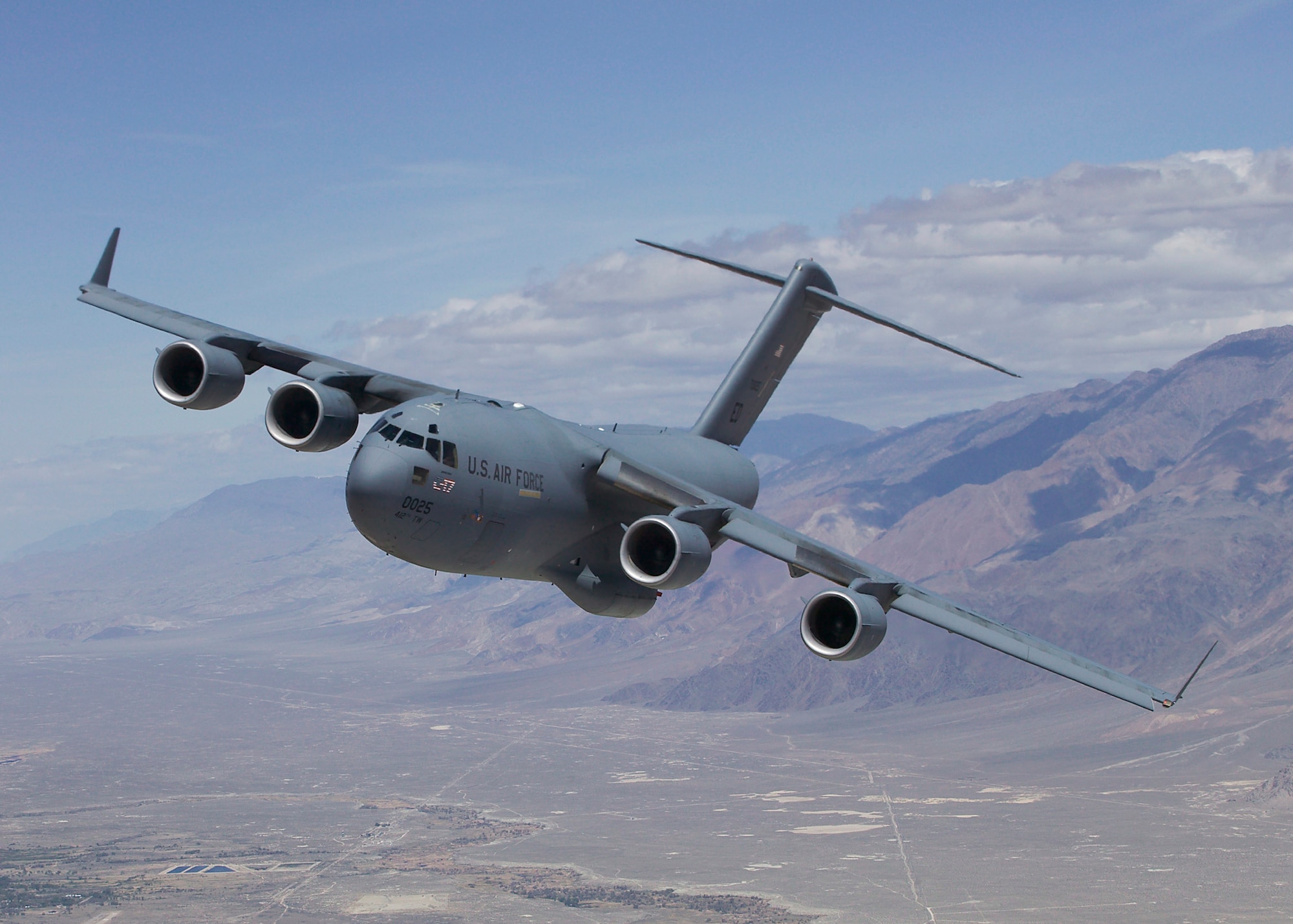 The C-17 Globemaster III T-1, shown here during a test mission in October 2007, completed its 1,000th flight March 10 while conducting tests on a hybrid air delivery system. T-1 is the first Air Force C-17 built to perform developmental testing. (Air Force photo)