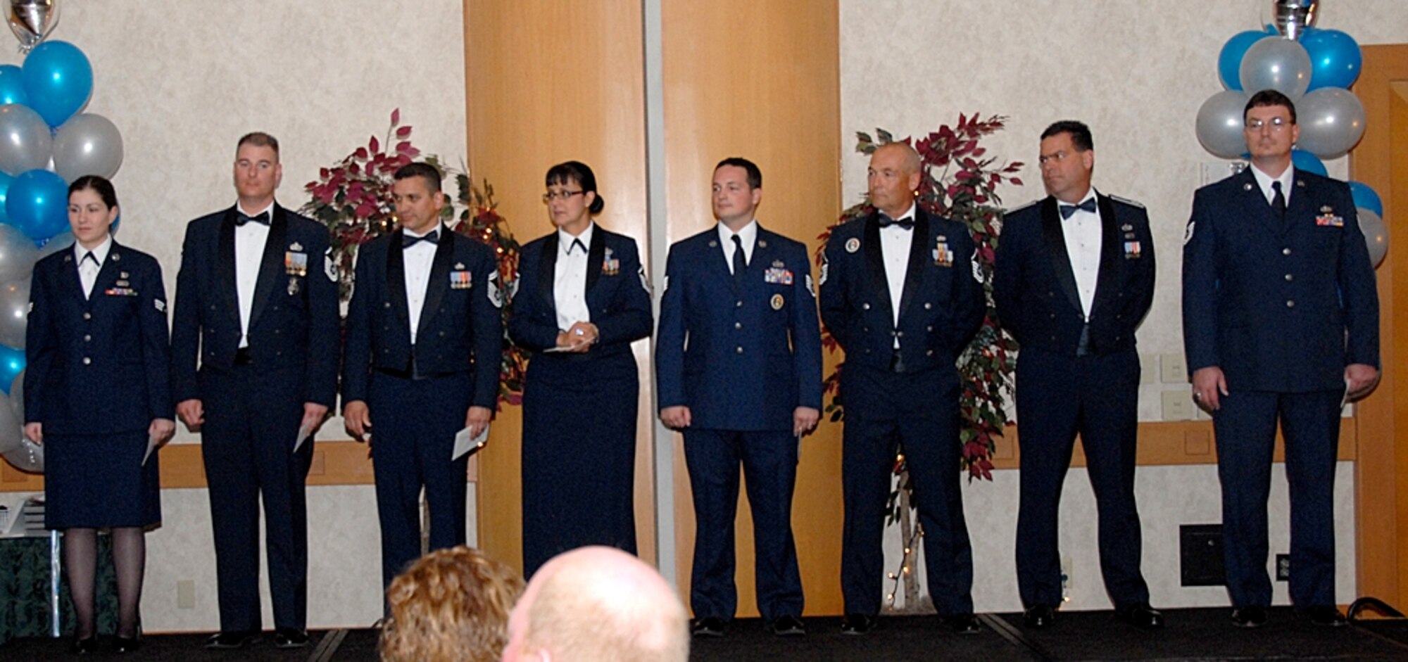 The 2007 Arizona Air National Guard Airman of the Year award winners are, from left to right: Senior Airman Jamie Hawkins, Airman of the Year; Master Sgt. Brian Thomas, Noncommissioned Officer of the Year; Senior Master Sgt. Daniel Gutierrez, Senior Noncommissioned Officer of the Year; Master Sgt. Diana Aragon, First Sergeant of the Year; Staff Sgt. Jared Davis, Honor Guard Member of the Year; Capt. Patrick McDonnell, Junior Officer of the Year; and Tech. Sgt. Joseph Duyck, the Command Chief Master Sergeant Award winner.