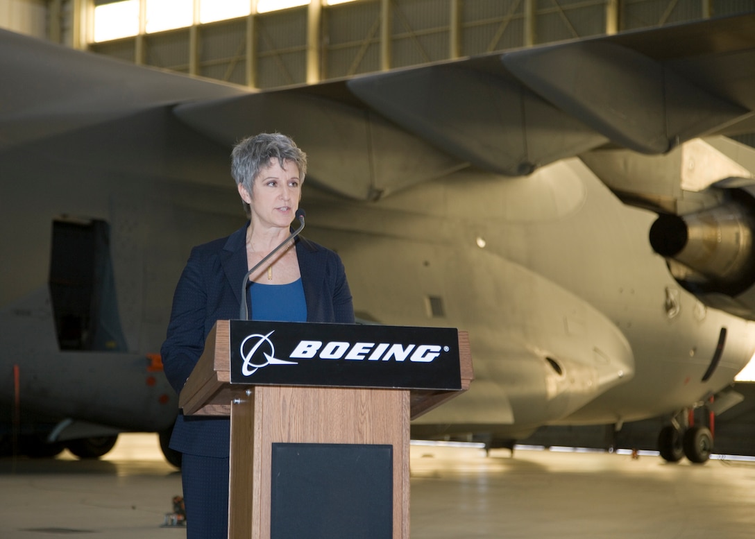 Jean Chamberlin, Boeing vice president and C-17 Globemaster III project manager, addresses the audience during a ceremony for the 1,000th flight of the T-1, the first C-17 test aircraft. The T-1 completed its 1,000th flight March 10. (Air Force photo by Bobbi Zapka)  