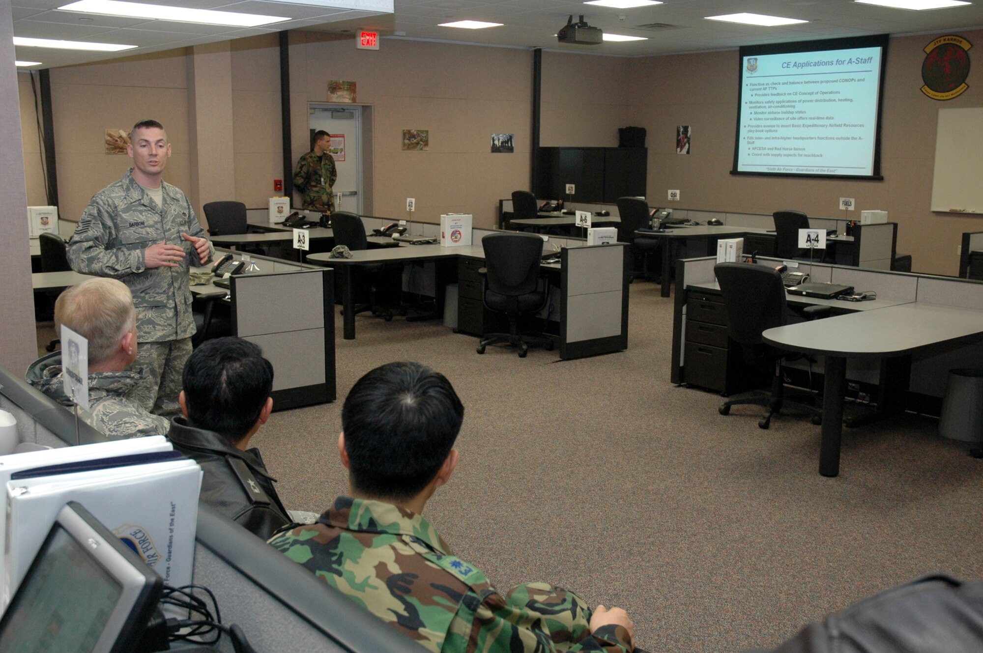 Tech. Sgt. John Barboni, from the U.S. Air Force Expeditionary Center's 421st Combat Training Squadron, describes the Air Forces staff training area to Republic of Korea Brig. Gen. Young-Ki Eun, Director, Civil Engineer Division, ROK Air Force Headquarters, during General Eun's official visit March 19, 2008, on Fort Dix, N.J.  General Eun visited to learn more about the Center and the Center's operations for Air Force Exercise Eagle Flag.  (U.S. Air Force Photo/Tech. Sgt. Scott T. Sturkol) 