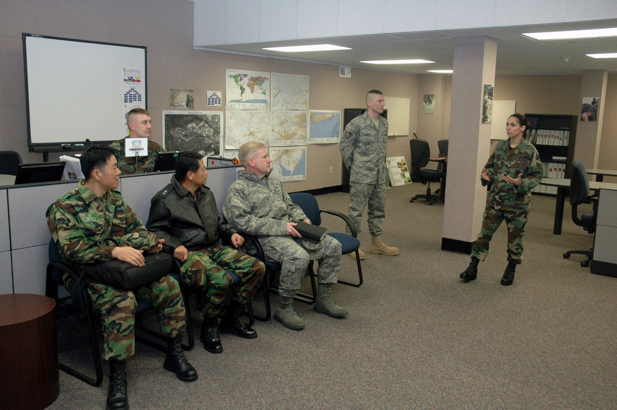 Staff Sgt. Jacqueline Baker, from the U.S. Air Force Expeditionary Center's 421st Combat Training Squadron, describes the Air Forces staff training area to Republic of Korea Brig. Gen. Young-Ki Eun, Director, Civil Engineer Division, ROK Air Force Headquarters, during General Eun's official visit March 19, 2008, on Fort Dix, N.J.  General Eun visited to learn more about the Center and the Center's operations for Air Force Exercise Eagle Flag.  (U.S. Air Force Photo/Tech. Sgt. Scott T. Sturkol) 