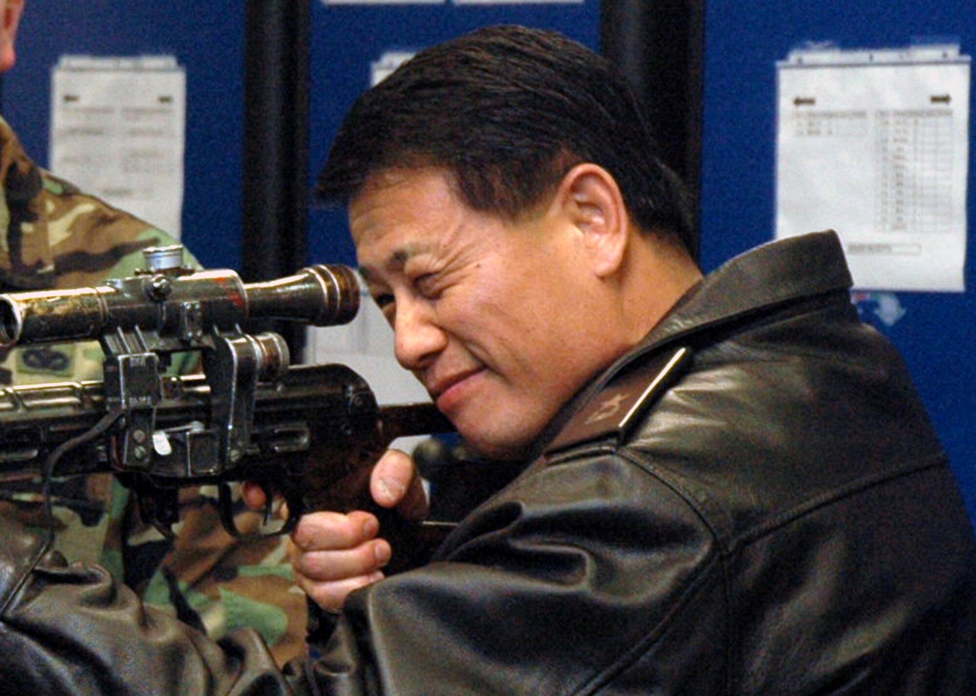 Republic of Korea Brig. Gen. Young-Ki Eun, Director, Civil Engineer Division, ROK Air Force Headquarters, takes aim through an unloaded World War II era Russian sniper rifle in the U.S. Air Force Expeditionary Center armory during an official visit March 19, 2008, on Fort Dix, N.J.  General Eun visited to learn more about the Center and the Center's operations for Air Force Exercise Eagle Flag.  The Center's armory has the Air Force's largest collection of foreign weapons on the East Coast.  (U.S. Air Force Photo/Tech. Sgt. Scott T. Sturkol) 