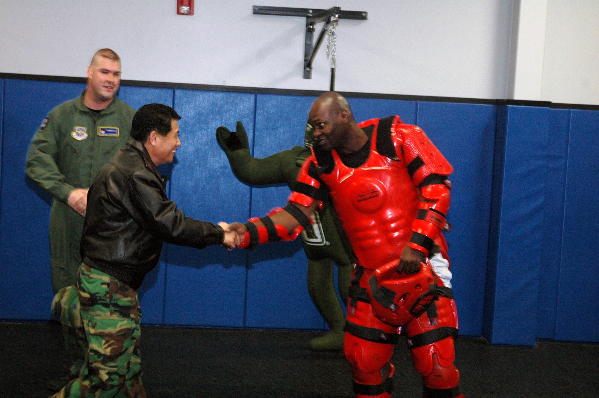 Republic of Korea Brig. Gen. Young-Ki Eun, Director, Civil Engineer Division, ROK Air Force Headquarters, shakes hands with Tech. Sgt. Jeffrey Cadogan, Phoenix Raven instructor from the 421st Combat Training Squadron, during General Eun's official visit March 19, 2008, on Fort Dix, N.J.  General Eun visited to learn more about the Center and the Center's operations for Air Force Exercise Eagle Flag.  (U.S. Air Force Photo/Tech. Sgt. Scott T. Sturkol) 
