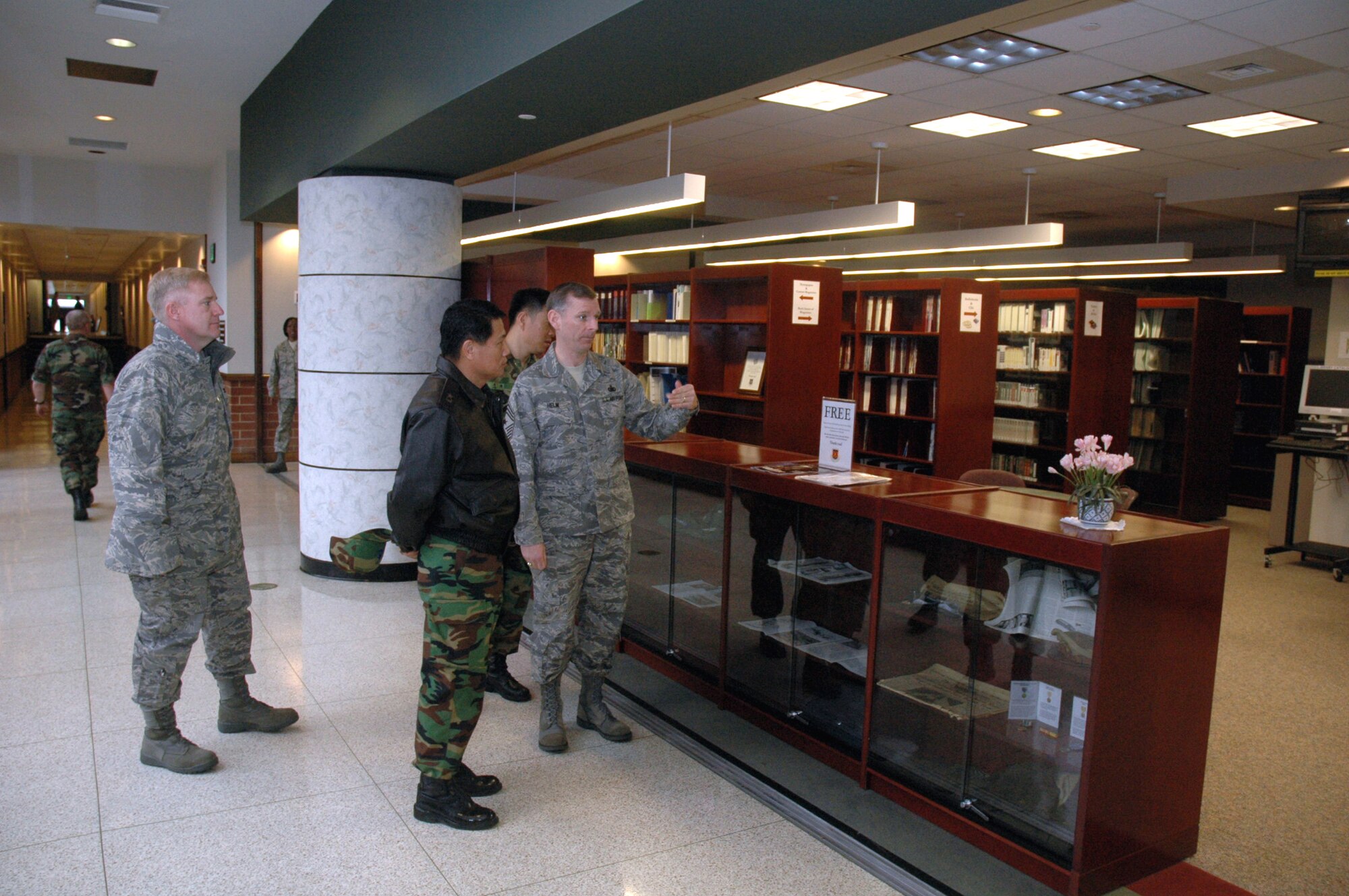 Chief Master Sgt. Jeffry Helm, U.S. Air Force Expeditionary center command chief, shows Republic of Korea Brig. Gen. Young-Ki Eun, Director, Civil Engineer Division, ROK Air Force Headquarters, the Gen. Ronald R. Fogleman library in the Center during General Eun's official visit March 19, 2008, on Fort Dix, N.J.  General Eun visited to learn more about the Center and the Center's operations for Air Force Exercise Eagle Flag.  (U.S. Air Force Photo/Tech. Sgt. Scott T. Sturkol) 
