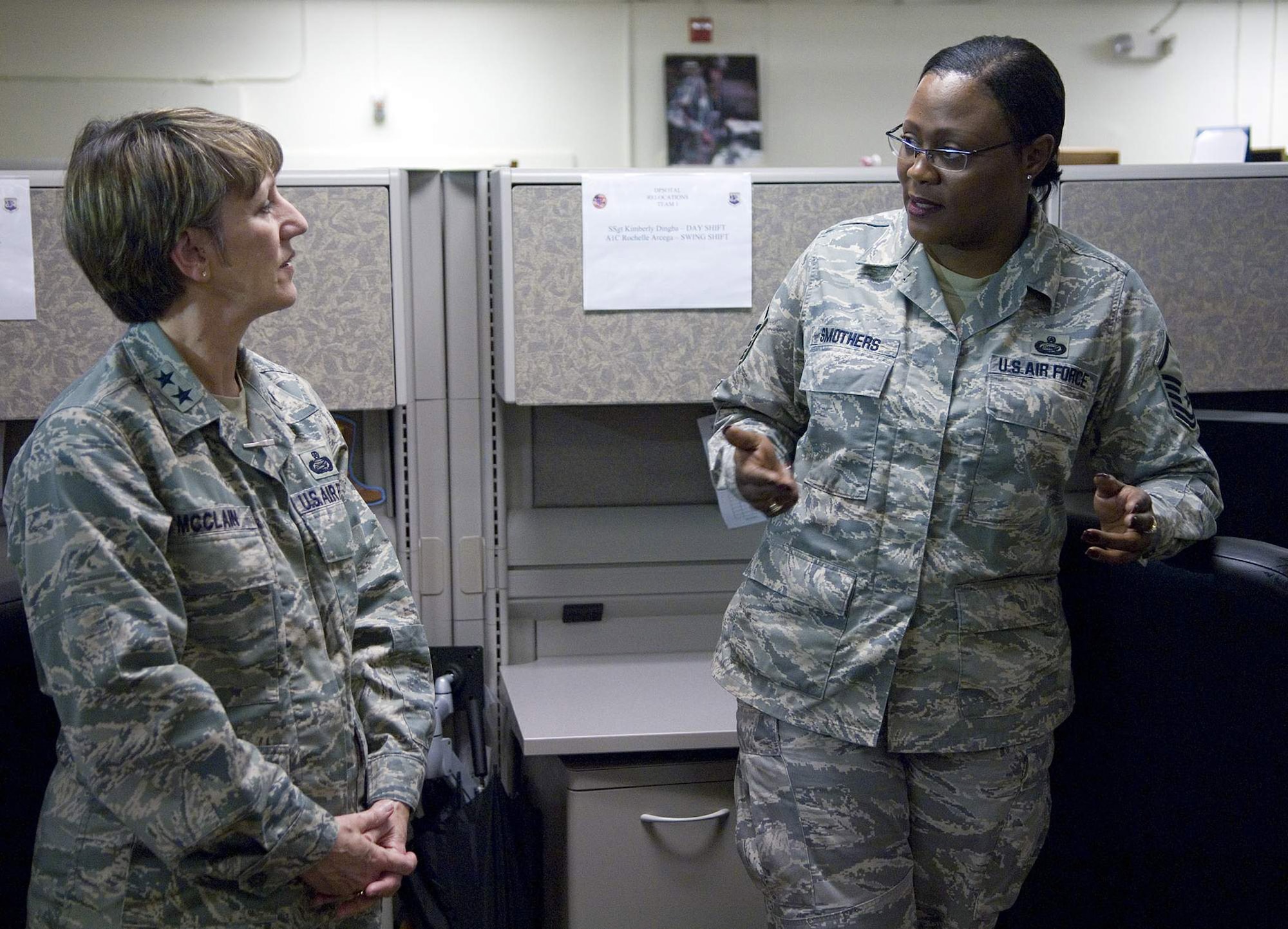 Maj. Gen. K.C. McClain talks with Master Sgt. Teresa Smothers March 18 at the Air Force Personnel Center's 24-hour-operations center. General McClain is the commander of the AFPC at Randolph Air Force Base, Texas. She is AFPC's 23rd commander and a 30-year-career Airman. AFPC members are responsible for developing personnel programs, implementing personnel policies and conducting personnel operations for 1.25 million Air Force military, civilian and retirees worldwide. The unit has 2,200 members. (U.S. Air Force photo/Staff Sgt. Bennie J. Davis III) 