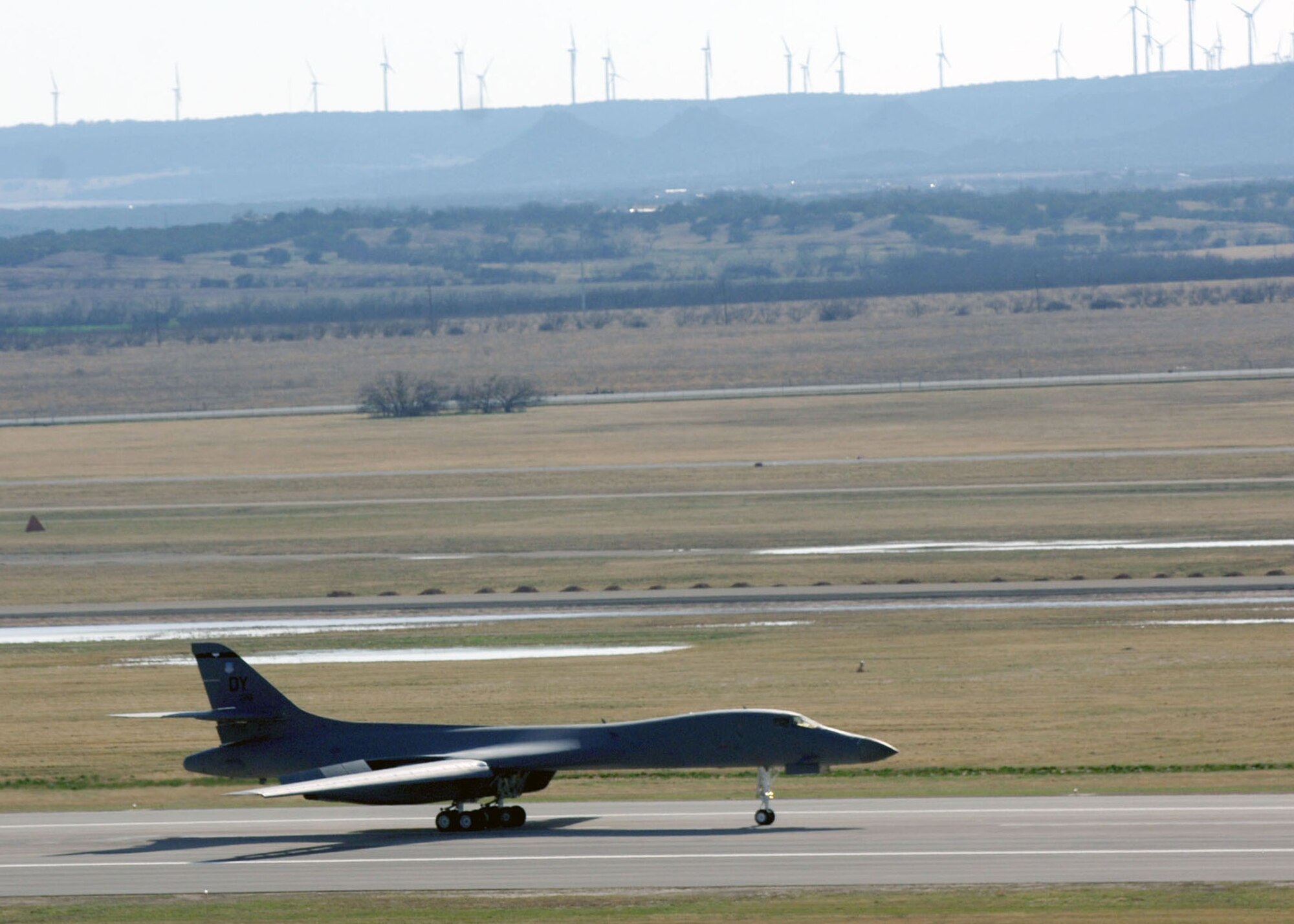 DYESS AIR FORCE BASE, TEXAS -- A 9th Bomb Squadron B-1 Bomber from Dyess Air Force Base coasts down the runway after the first supersonic flight using a 50/50 blend of synthetic and petroleum based fuel Mar 19. The flight marks a point in history for sythetic fuels. (U.S. Air Force Photo by Airman 1st Class Micheal Breaux)