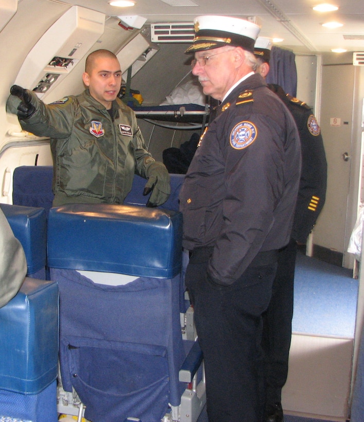 An aircrew member on the E-3 Sentry Airborne Warning and Control System, or AWACS, aircraft from the 552nd Air Control Wing based at Tinker Air Force Base, Okla., briefs Rome Fire Department Chief Roger Sabia about the AWACS mission.

