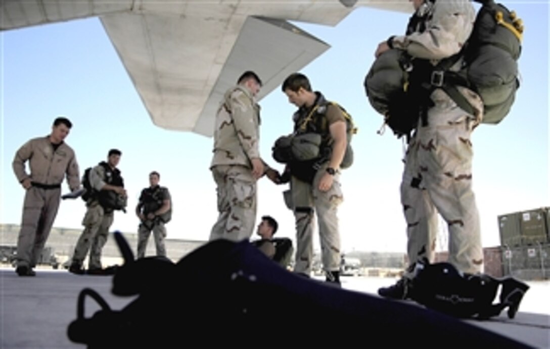 U.S. Air Force pararescuemen conduct pre-flight checks on their parachutes before boarding an HC-130 Hercules aircraft for a training jump over Djibouti March 13, 2008. The men are assigned to the 82nd Expeditionary Rescue Squadron.
