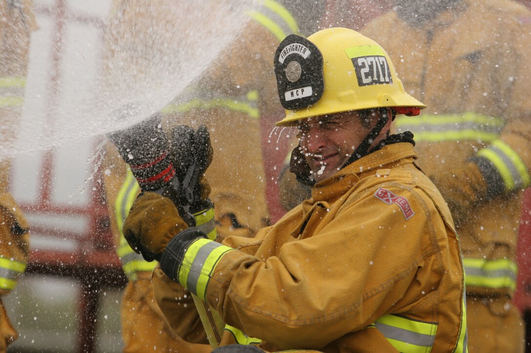 Hans J. Niederberger, firefighter, Fire Station 7, Fire and Emergency Services,practices nozzle techniques to ensure fire safety in the event of a fire. Using the wrong nozzle technique can extinguish too much of a fire, increasing steam drastically. Extreme exposure to steam can injure and possibly kill victims in addition to subjecting them massive flames and smoke inhalation.