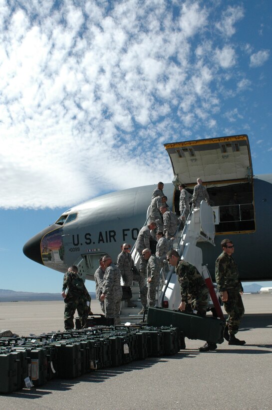 Arizona Air National Guard Security Forces troops load their deployment gear on a KC-135 tanker at Tucson International Airport. The 19 Airmen assigned to the 162nd Fighter Wing hitched a ride with the 171st Air Refueling Wing on their way to Baghdad International Airport, Iraq, for a voluntary six-month tour of duty, Feb. 24. The Guardsmen, who provide full-time security for the 162nd Fighter Wing at Tucson International Airport, will use their training and expertise to secure Iraq’s largest airport. The Airmen are scheduled to return to Tucson in early September. (Photo by Capt. Gabe Johnson, 162nd Fighter Wing)