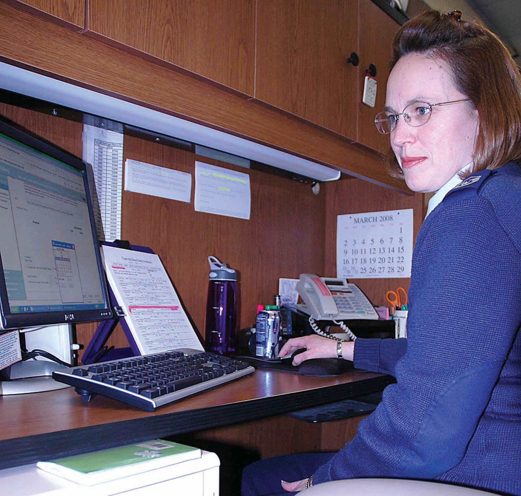 With just a few keystrokes, Master Sgt. Laura Elliott, 446th Operations Support Flight, McChord Air Force Base, Wash., can send out emergency notifications to all Reservists in the 446th Airlift Wing.  On the direction of the wing commanderr, Sergeant Elliott will employ the new Air Force Reserve Command emergency notificaiton system to deliver messages ranging from a specific squadron's recall, to  delayed reporting due to weather. (U.S. Air Force photo/Airman First Class Patrick Cabellon)