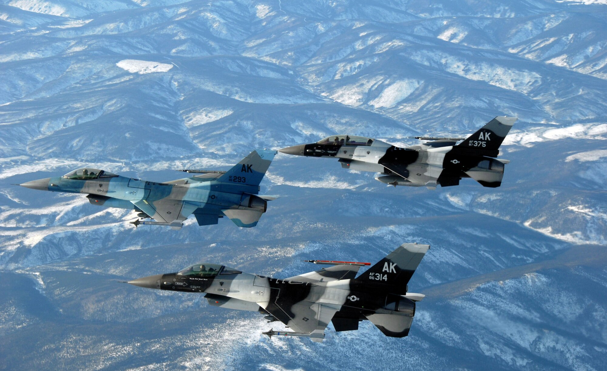 Three F-16 Fighting Falcon from the 18th Aggressor Squadron assigned to Eielson Air Force Base fly together in formation over parts of the Pacific Alaska Range Complex prior to a combat training mission March 20, 2008 in preparation for the first Red Flag-Alaska exercise.  This training exercise allows the pilots to practice in flight fighting and maneuvering capabilities that will be used against the participants in the Red Flag-Alaska exercise to simulate the capabilities of enemy aircraft.

(U.S Air Force Photo by Staff Sgt. Eric T. Sheler)

