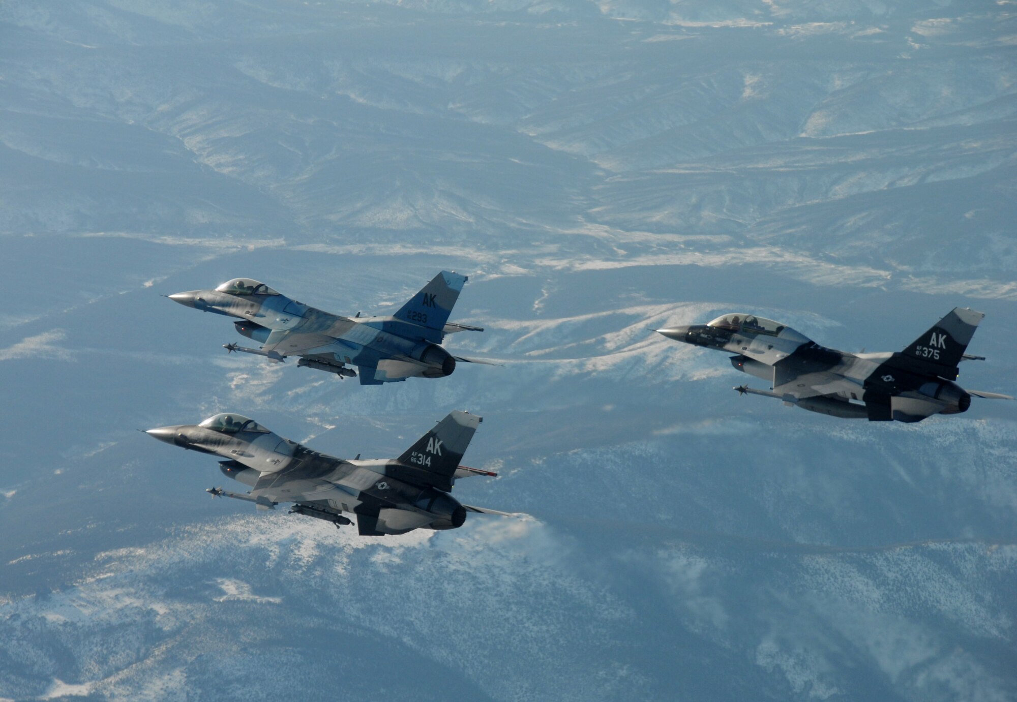 Three F-16 Fighting Falcon from the 18th Aggressor Squadron assigned to Eielson Air Force Base fly together in formation over parts of the Pacific Alaska Range Complex prior to a combat training mission March 20, 2008 in preparation for the first Red Flag-Alaska exercise.  This training exercise allows the pilots to practice in flight fighting and maneuvering capabilities that will be used against the participants in the Red Flag-Alaska exercise to simulate the capabilities of enemy aircraft.

(U.S Air Force Photo by Staff Sgt. Eric T. Sheler)
