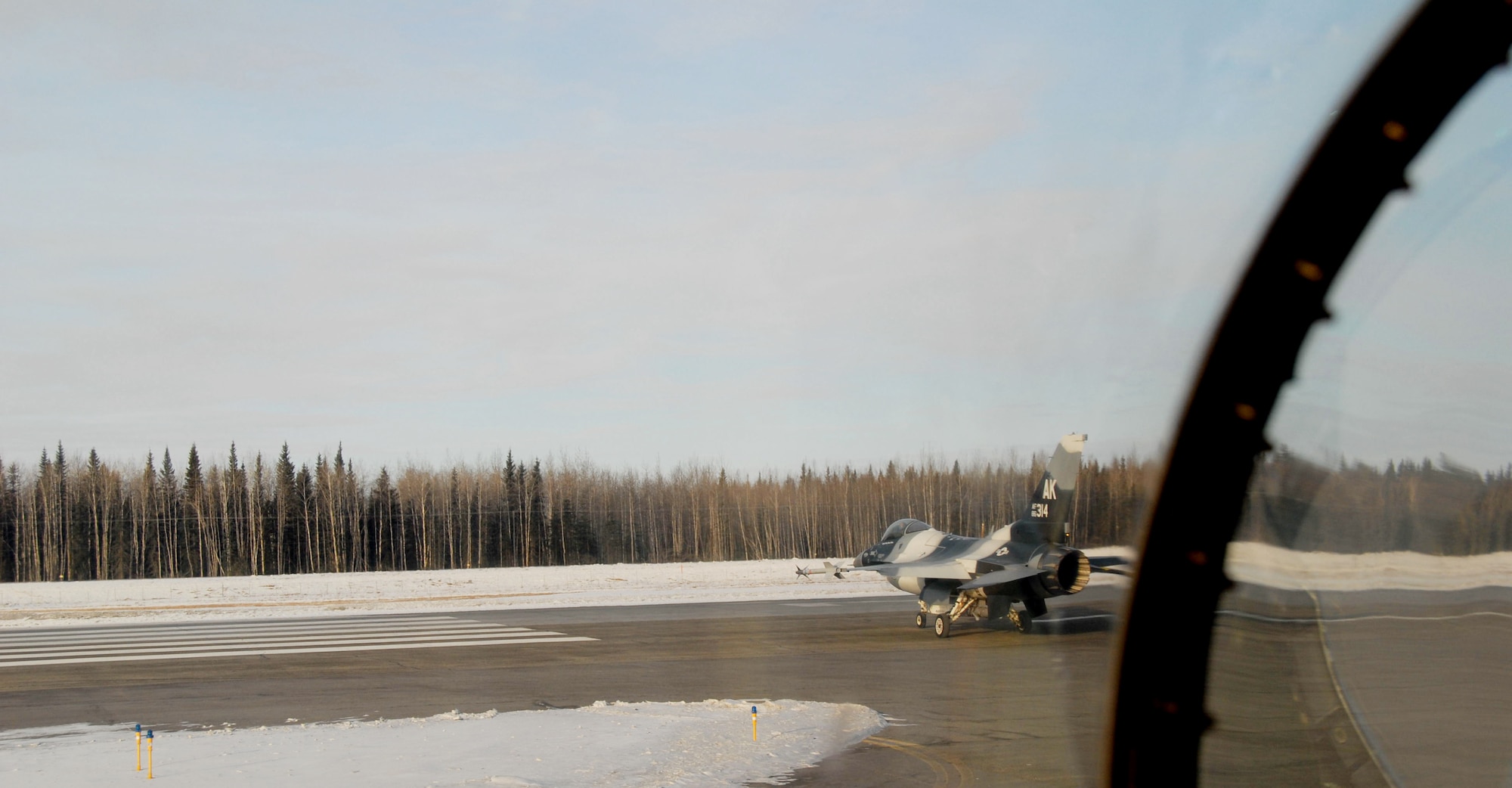 An F-16 Fighting Falcon from the 18th Aggressor Squadron taxis the Eielson Air Force Base flight line prior to take off for a combat training mission over the Pacific Alaska Range Complex March 20, 2008. in preparation for the first Red Flag- Alaska exercise.  This training exercise allows the 18th Aggressor Squadron pilots to practice in flight fighting and maneuvering capabilities that will be used against the participants in the Red Flag-Alaska exercise to simulate the capabilities of enemy aircraft.

(U.S Air Force Photo by Staff Sgt. Eric T. Sheler)
