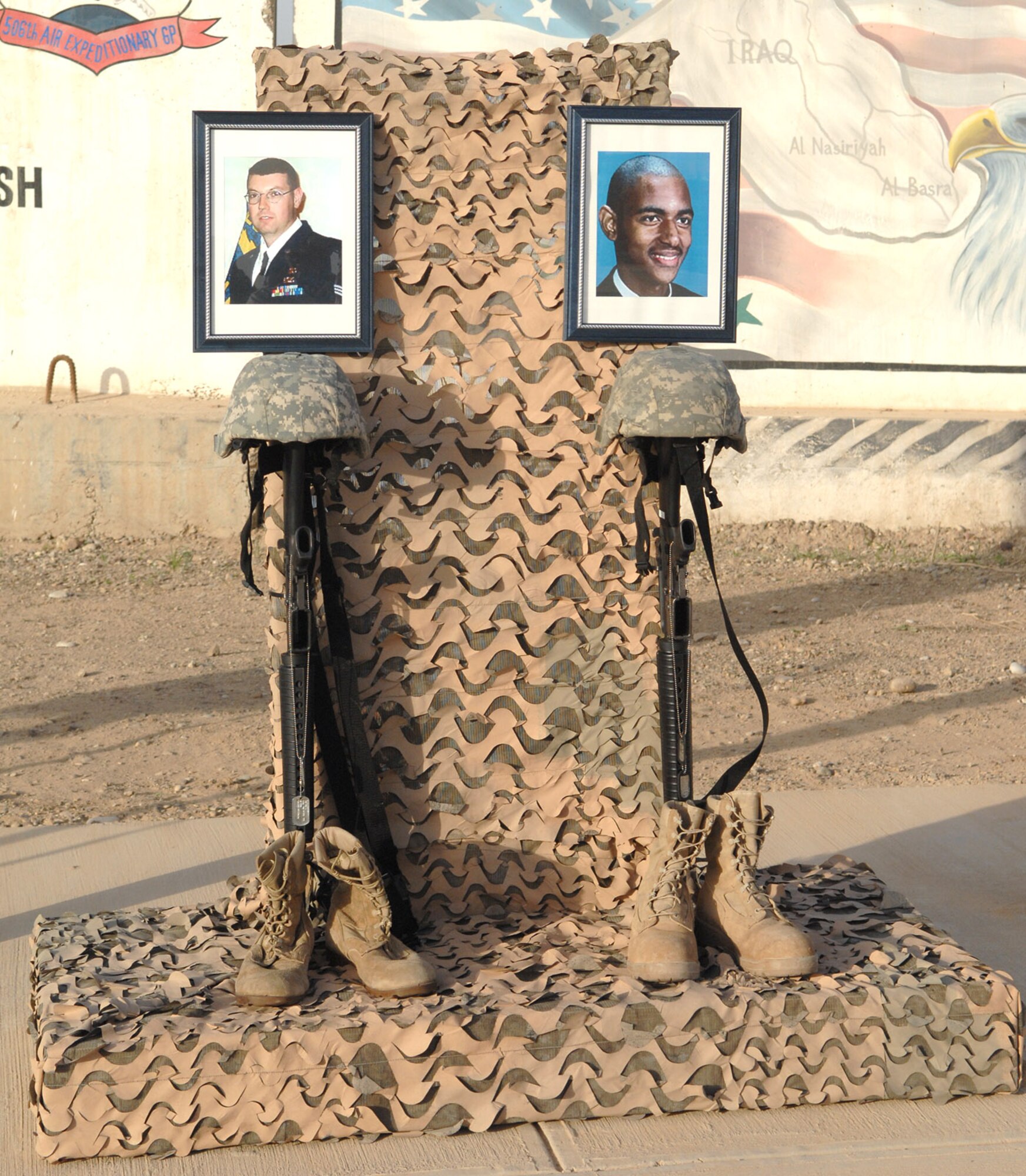 The 727th Expeditionary Air Control Squadron set up a memorial in-remembrance of two of the unit's fallen Airmen during a ceremony to commemorate the fifth anniversary of Operation Iraqi Freedom March 20 here. Staff Sgt. Patrick Griffin and Airman 1st Class Antoine Holt, both from the 727th EACS, died during combat operations in 2003 and 2004. (U.S. Air Force photo by Senior Airman SerMae Lampkin)