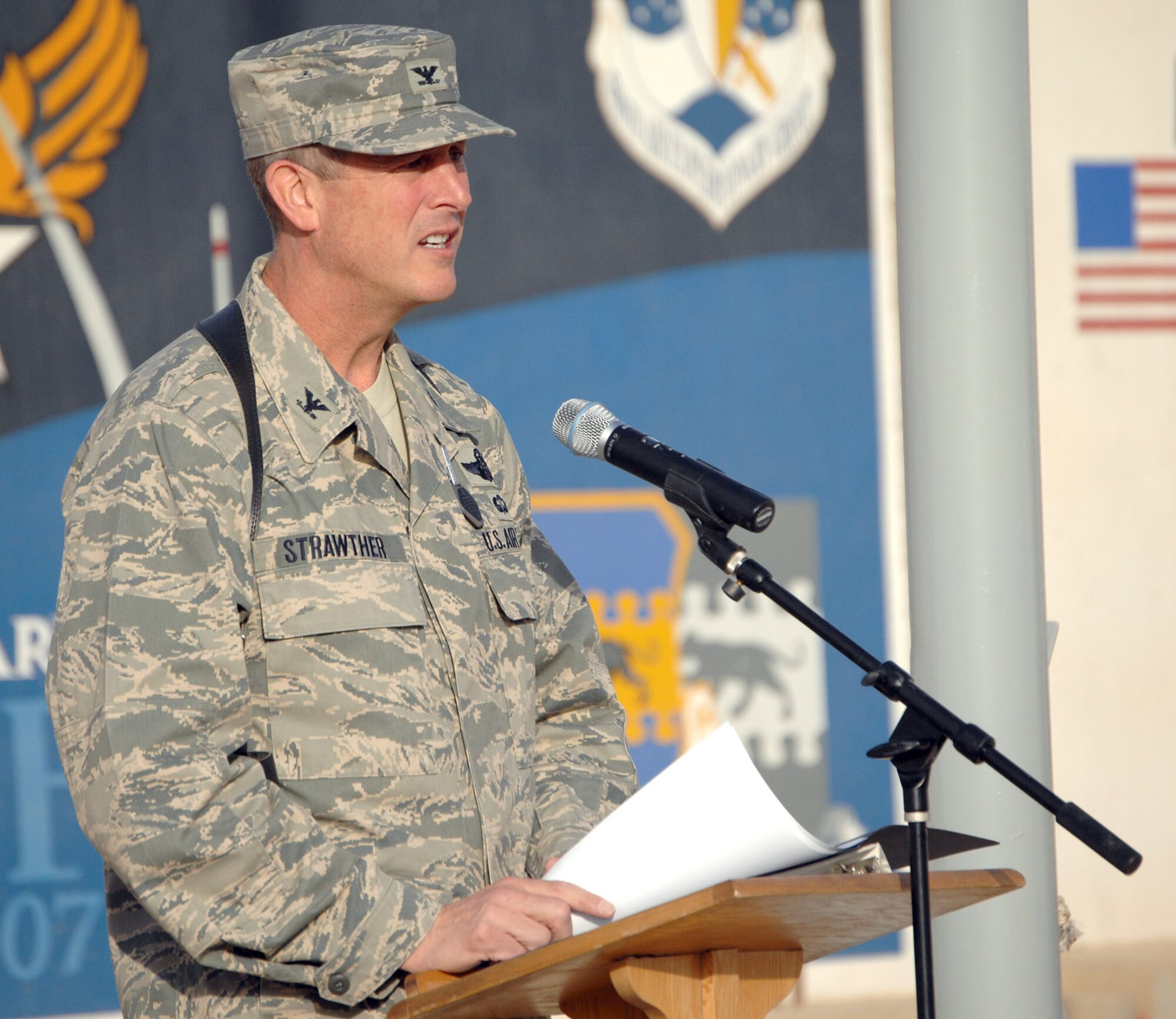 Col. Timothy Strawther, 506th Air Expeditionary Group commander, recites the names of the 42 Airmen who gave the ultimate sacrifice during Operation Iraqi Freedom. The speech was part of an event to commemorate the fifth anniversary of Operation Iraqi Freedom. (U.S. Air Force photo by Senior Airman SerMae Lampkin)