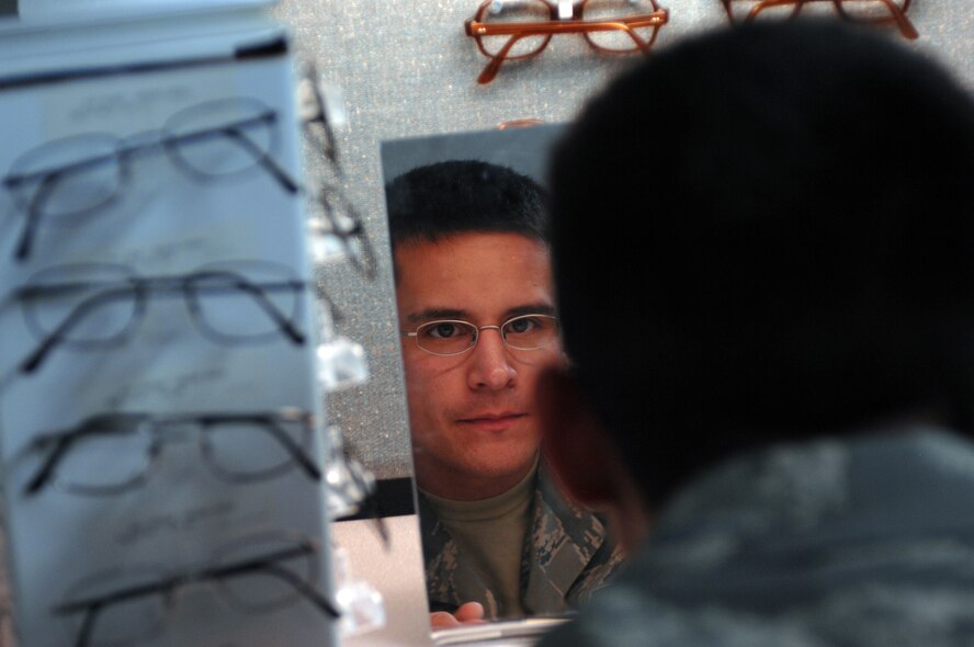 DYESS AIR FORCE BASE, Texas -- 1st Lieutenant Rudy Talamantez, 7th Logistics Readiness Squadron Installation Deployment Officer, picks out new eye glasses, March 18. After completing the eye exams, patients choose their new frames and get them sent off for their prescriptions to be filled. (U.S. Air Force photo by Senior Airman Courtney Richardson)