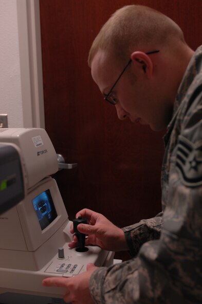 DYESS AIR FORCE BASE, Texas -- Staff Sergeant Zachary Clemmons, Ophthalmic laboratory technician, performs a tonometry on a patient, March 18. Most individuals know this test as a puff or glaucoma test, but it is a test that meassures the pressure in the eyes. (U.S. Air Force photo by Senior Airman Courtney Richardson)